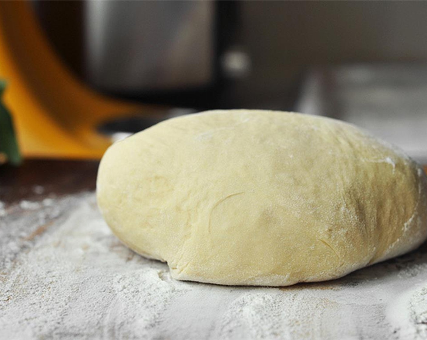 step 7 Place a kitchen towel, not a paper towel, on a baking sheet and sprinkle lightly with bread flour. You might need two baking sheets. Roll out the dough about 1/2 of an inch thick on a lightly floured surface.