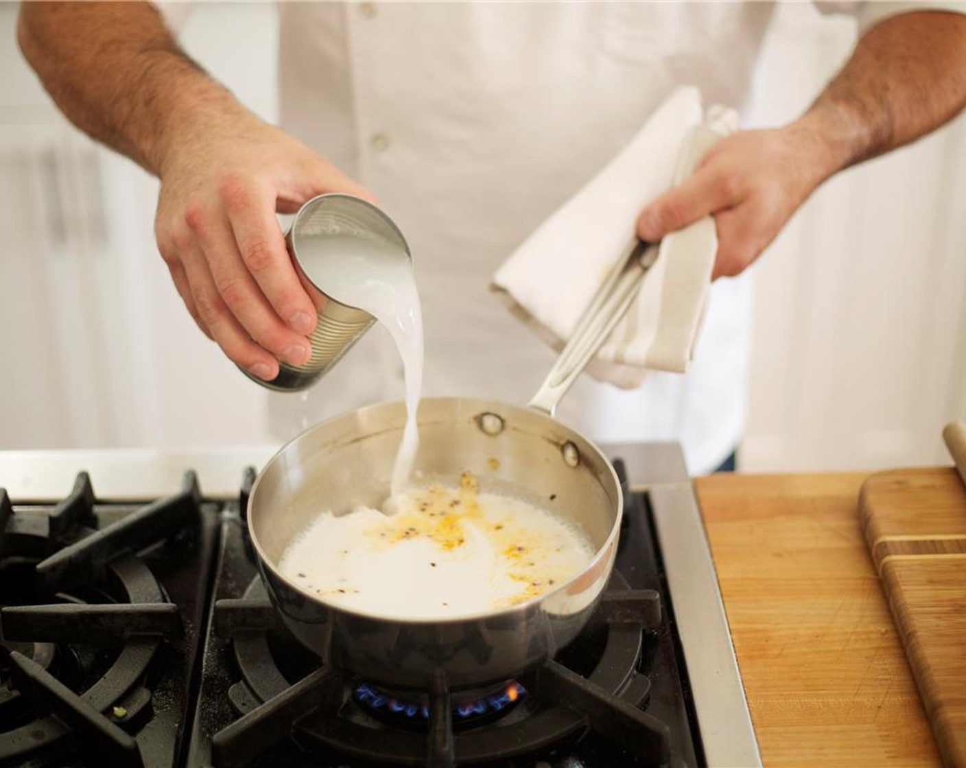 step 2 Add the Coconut Milk (1 can), Granulated Sugar (2 Tbsp), and Vegetable Base (1 pckg). Refill can with water, about two cups, and add to saucepan and stir. Bring to a boil.