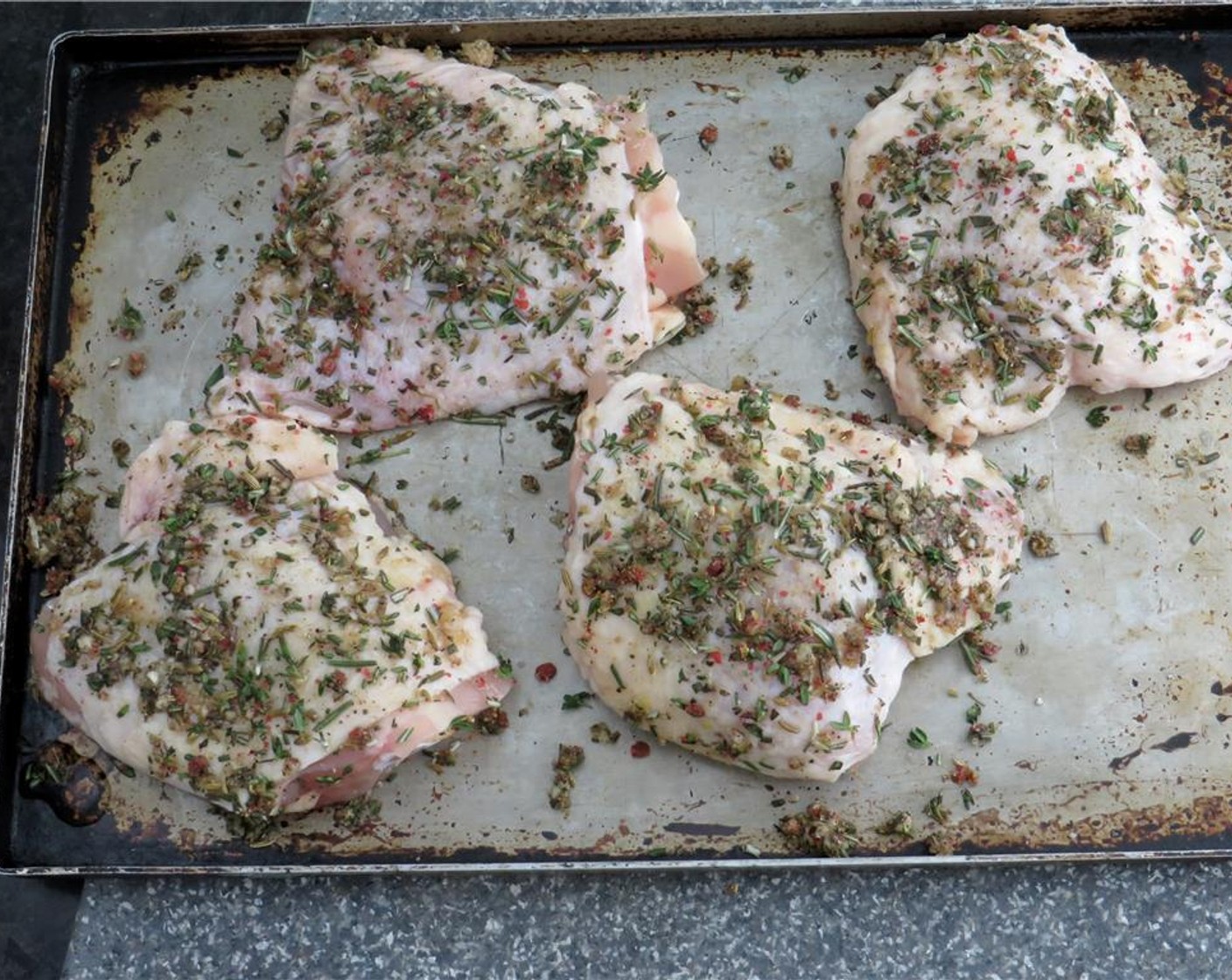 step 3 Liberally sprinkle the rub onto both sides of the chicken, and press with your fingers so that it adheres.