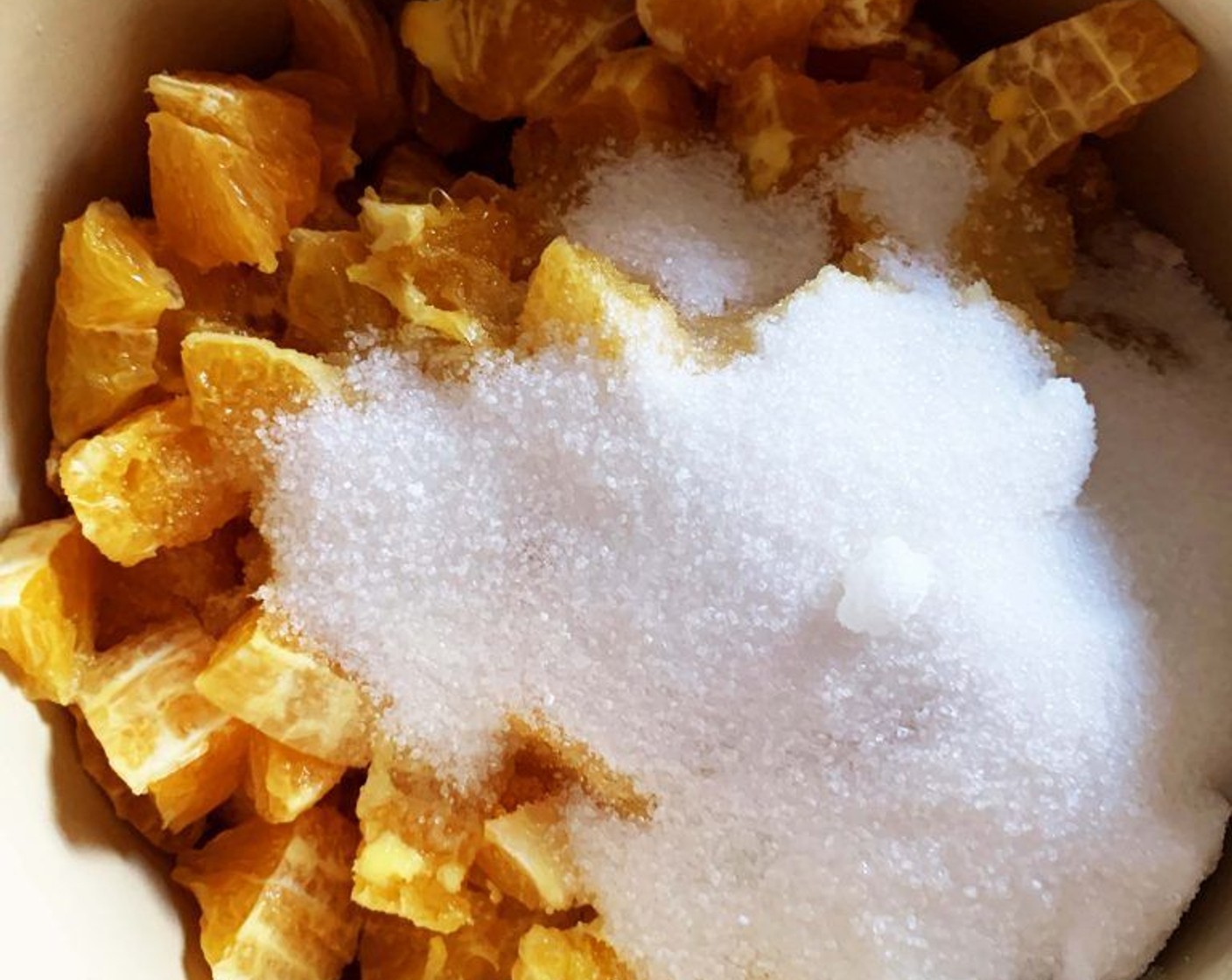 step 2 Remove the internal white skin and chop the juicy part of the oranges into pieces. Place them into a large pot. Add Granulated Sugar (1 1/2 cups) and bring to a gentle boil.