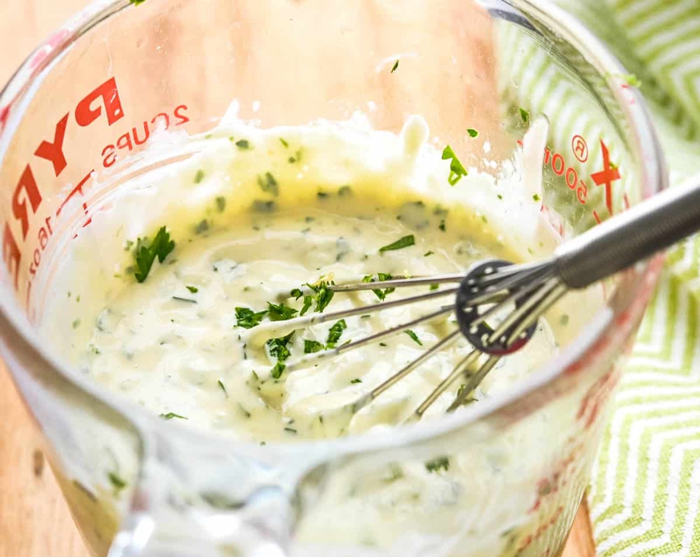 step 2 Measure out about 3/4 cup of Mayonnaise (3/4 cup) in a 2-cup glass measure. Add the zest and juice from the Lime (1), Habanero Hot Sauce (1 Tbsp), Freshly Ground Black Pepper (1/2 tsp), and Fresh Cilantro (1/2 cup). Whisk to combine.