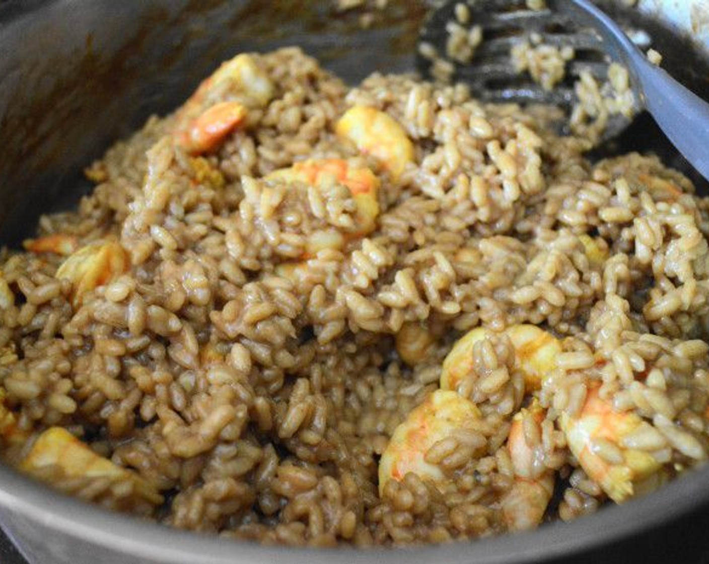 step 10 At this point get the shrimp back into the pan to warm them through along with the remaining Plain Greek Yogurt (1 Tbsp). Stir it all together to combine it into a luscious curried shrimp risotto. Take it off the heat.