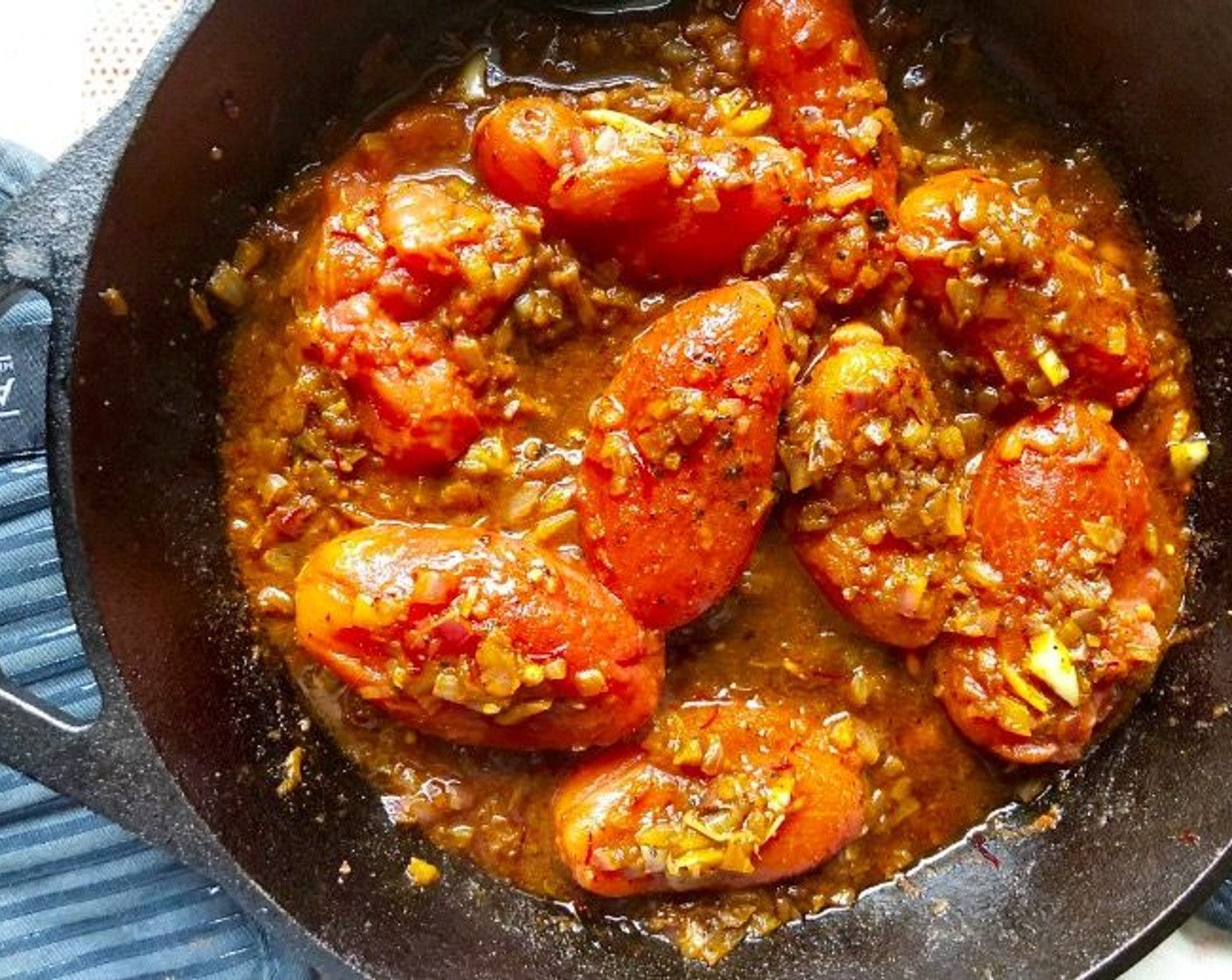 step 8 Add the Whole Peeled Plum Tomatoes (1 can) and very gently coat them with the onion hash. Cover with a lid and allow to gently simmer for 8-10 minutes until the tomatoes are softened and just beginning to break down.