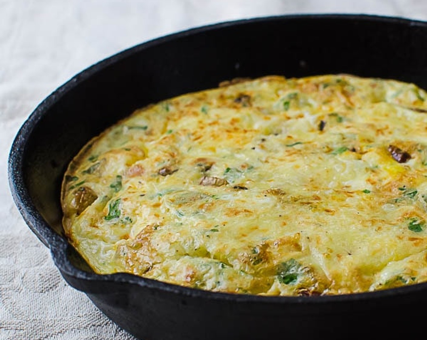 step 8 Turn the oven to broil and heat for 1-2 minutes, until the top of the frittata is lightly golden.