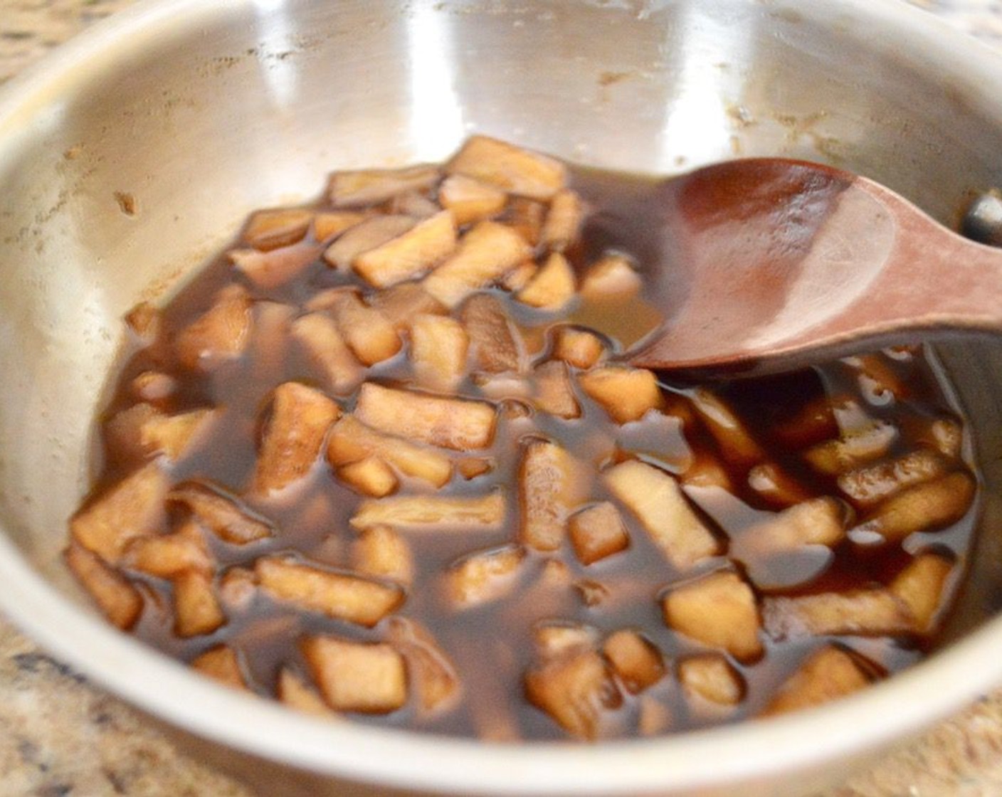 step 7 It's time to make the easy apple syrup. Simply combine the diced Apples (3), Water (2 cups), Dark Brown Sugar (1 cup), and Ground Cinnamon (1/2 tsp) in the same saucepan you made the apple cider in. Bring the mixture a low boil and let it thicken and become syrupy for about 15 minutes, stirring occasionally.