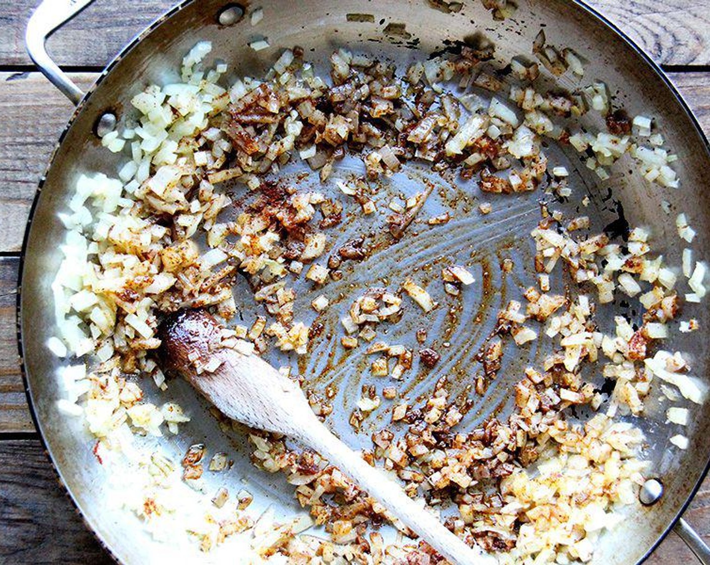 step 1 In a large pan set over medium heat, sauté the Onions (1 1/2 cups) and Garlic (2 cloves) in Olive Oil (3 Tbsp) until the onions are translucent.