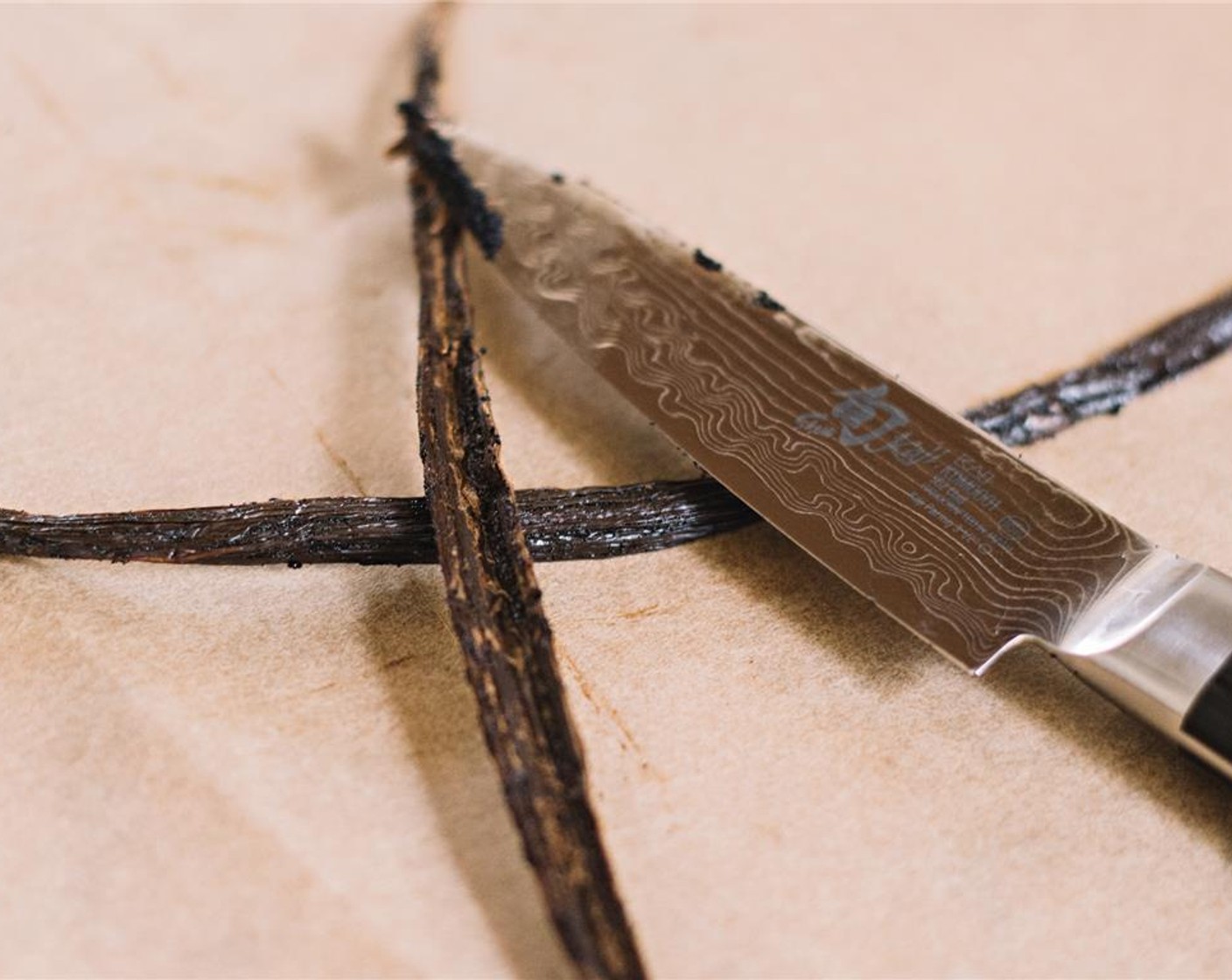 step 4 Split the simply organic whole Madagascar Vanilla Bean (1) open with the tip of a sharp paring knife. Use the side of the knife to scrape the beans out of the pod.