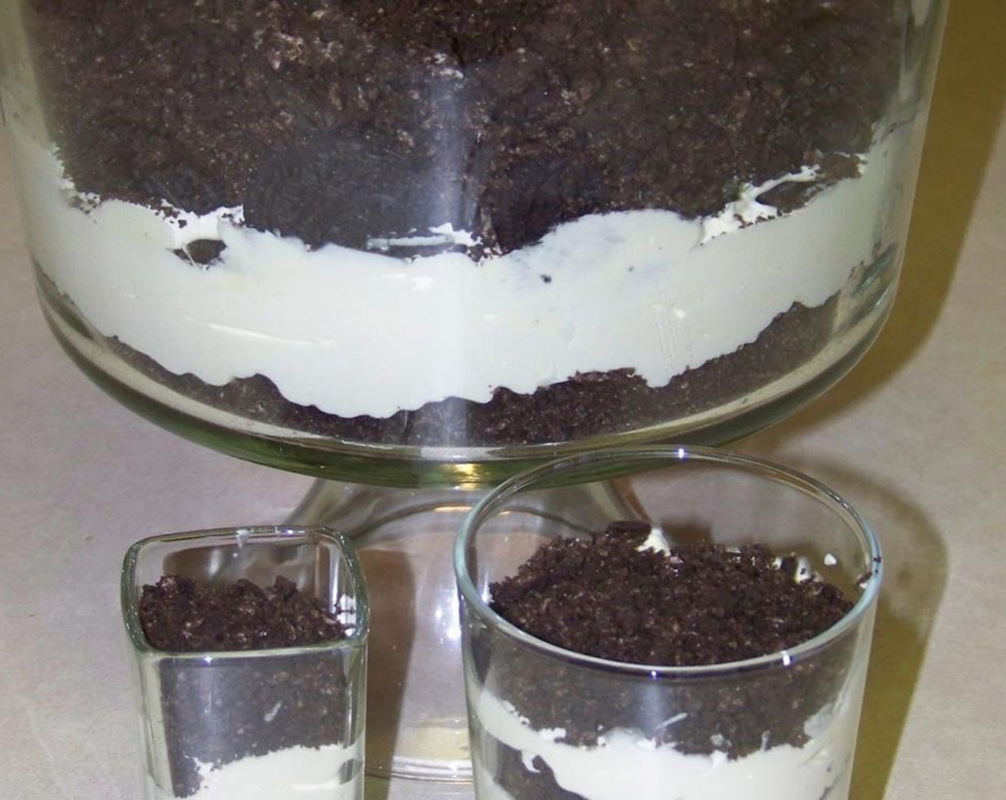 step 3 To make the trifles, make a thin oreo layer and top with the custard, repeating to make alternate layers. Then top with the rest of the Whipped Topping (3 3/4 cups).