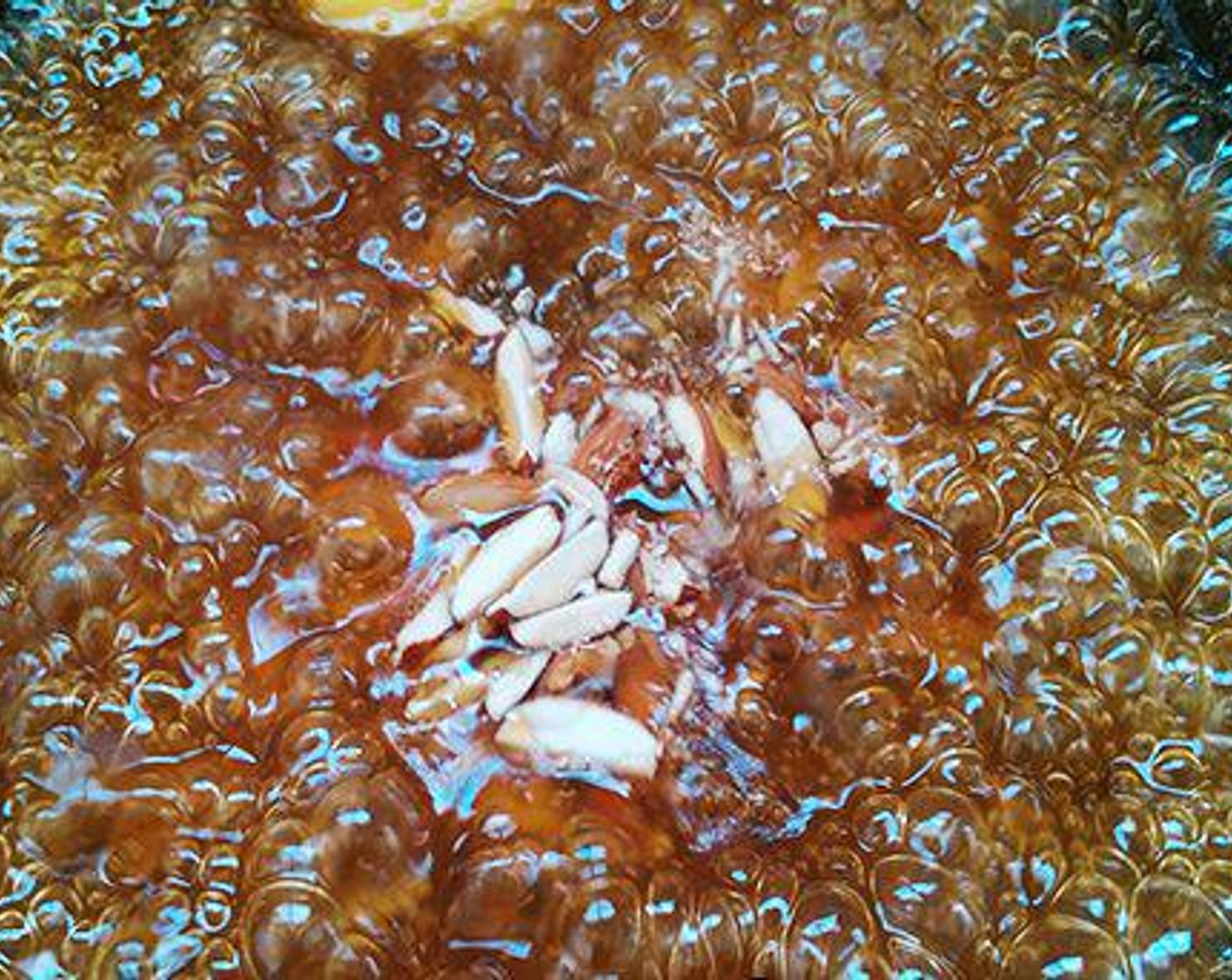 step 2 Do not stop stirring at any time. Once the mixture starts to thicken, add Cashew Nuts (2 Tbsp), Butter (1 Tbsp), Ground Cardamom (1/4 tsp), Rose Water (2 pinches), and Saffron Threads (1 pinch). Let the mixture become thick and until starts to leave the sides of the pan.