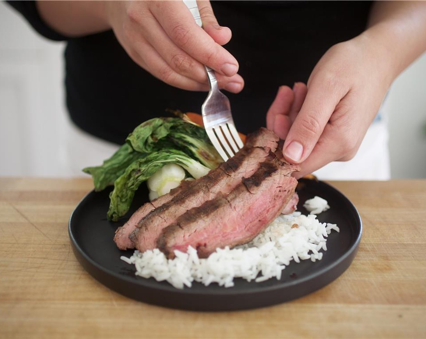 step 15 Thinly slice the flank steak on a bias against the grain to make six even slices.