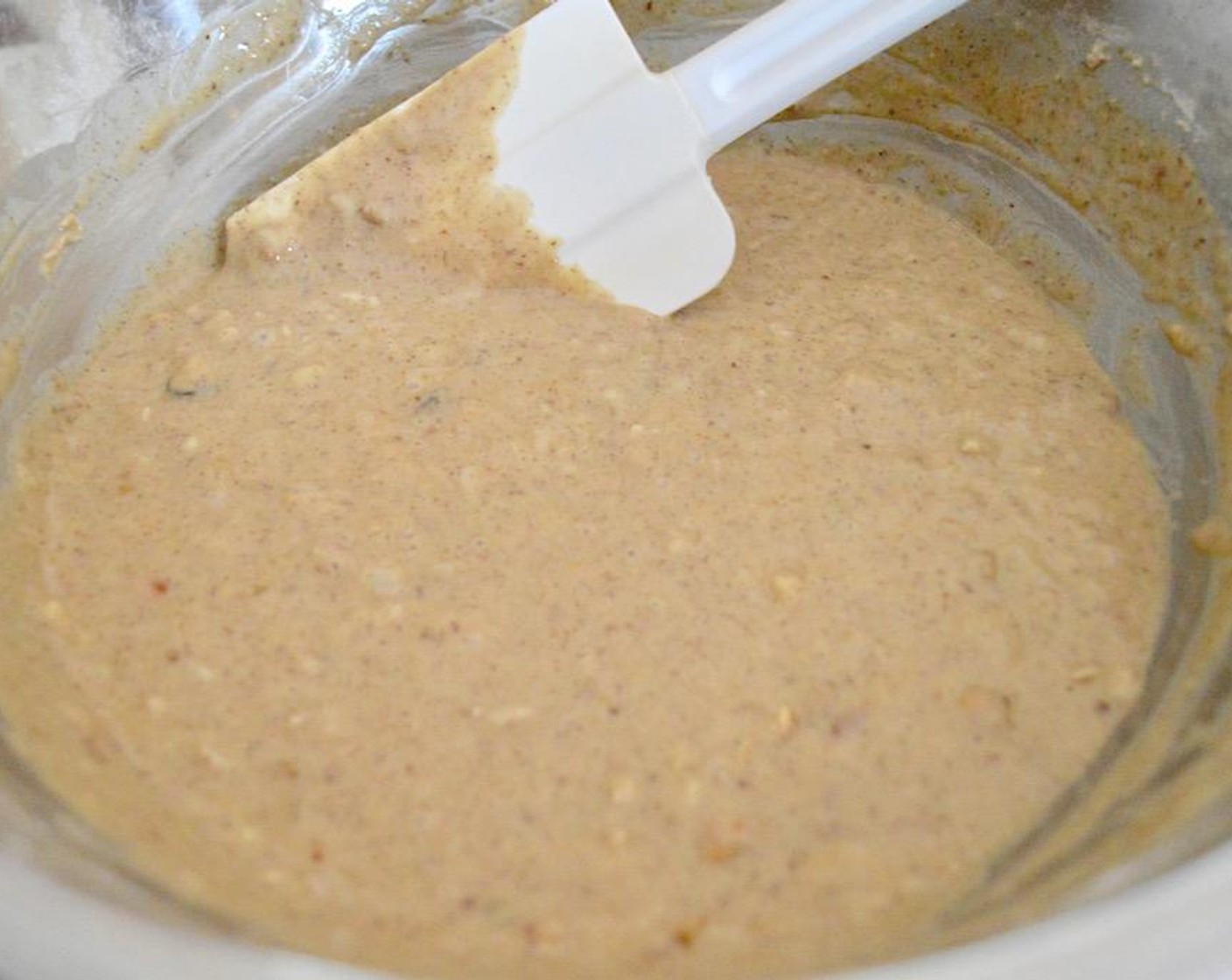 step 4 Pour the wet ingredients into the dry ingredients and whisk it all together until it is a smooth batter. Switch to a spatula and fold in the Unsweetened Shredded Coconut (1/2 cup) and Granola (1/2 cup).