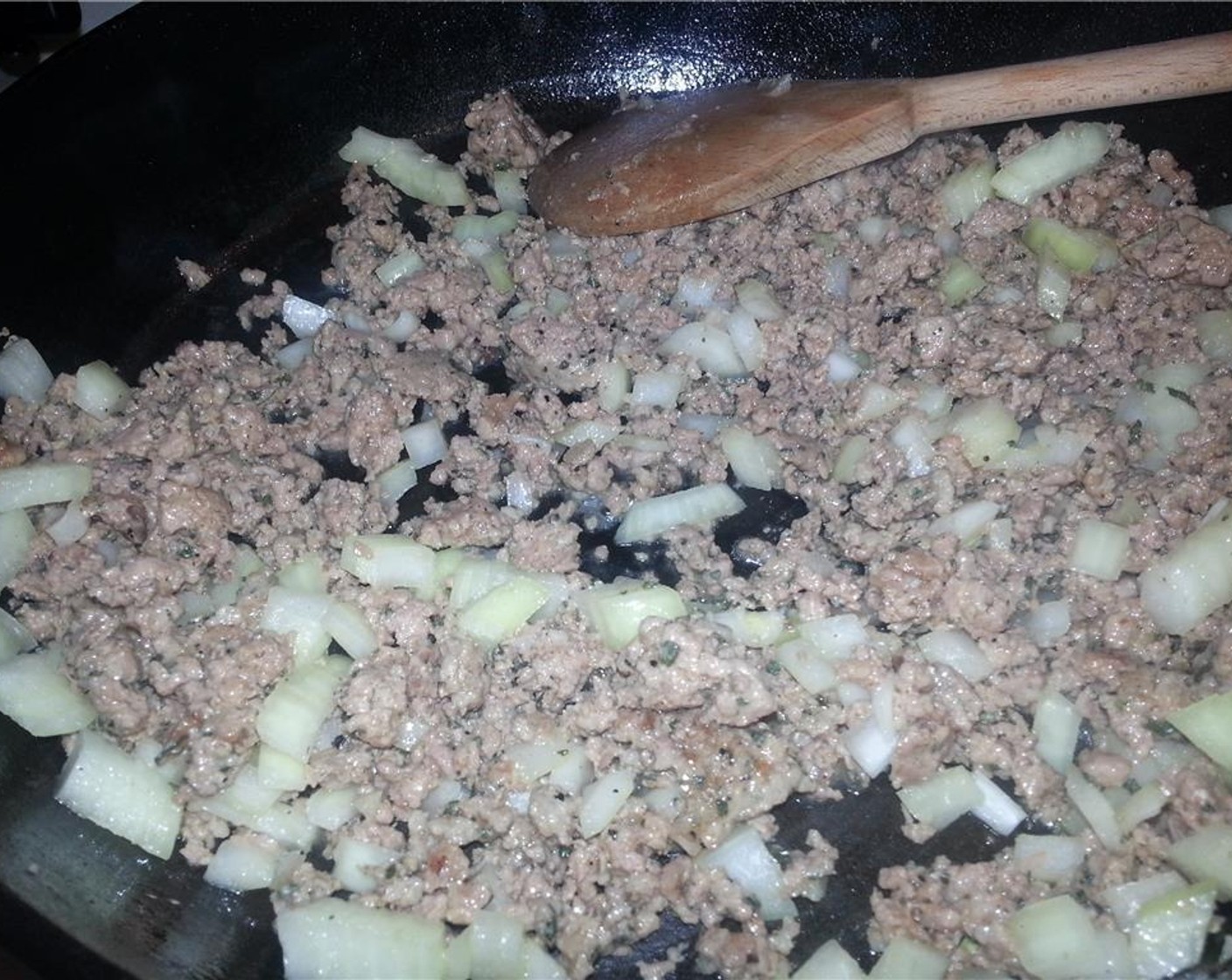 step 3 When almost all the sausage has browned, add the diced onions to the pan. Allow the onions to sweat and cook until the sausage bits begin to brown and crisp up.