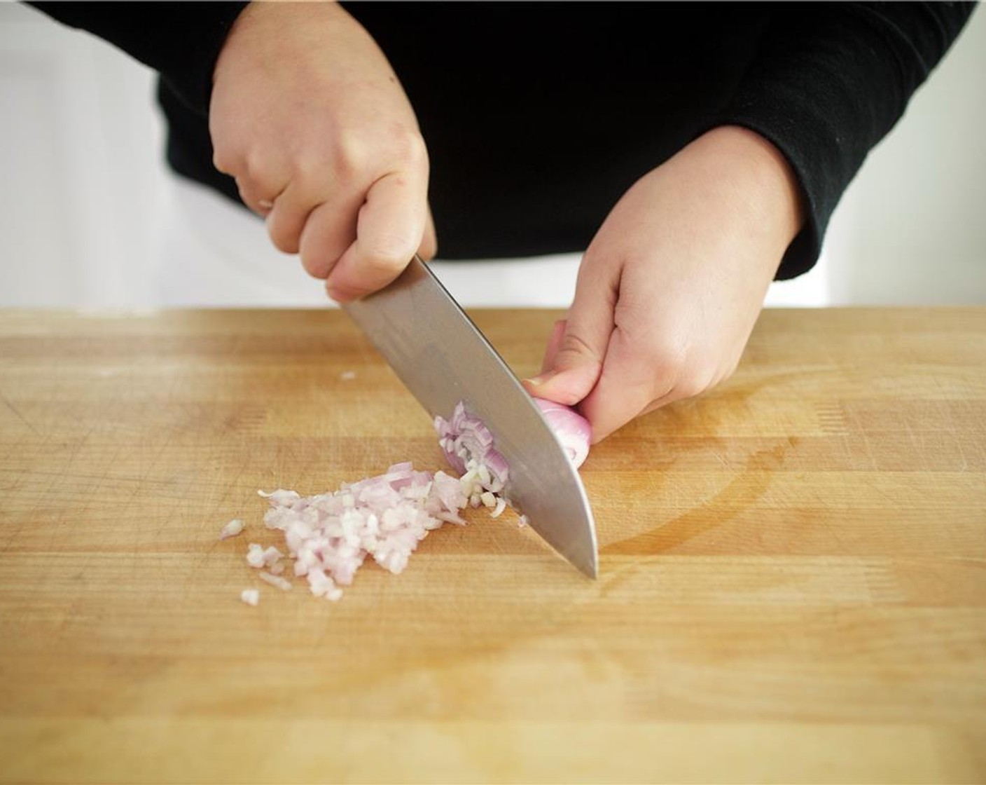 step 5 Meanwhile, peel and dice only 1/2 of the Onion (1/2). Finely chop the Shallots (4). Set both aside.