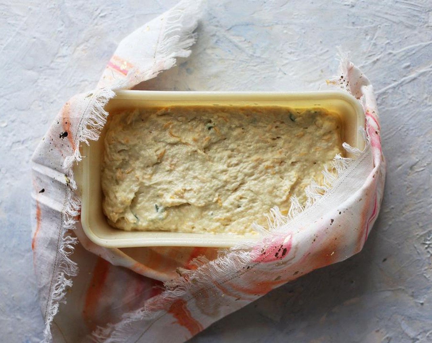 step 4 Place in a greased bread pan and smooth with spoon. Place in the preheated oven for 45 – 50 minutes. Let cool a few minutes before turning out onto a cooling rack.