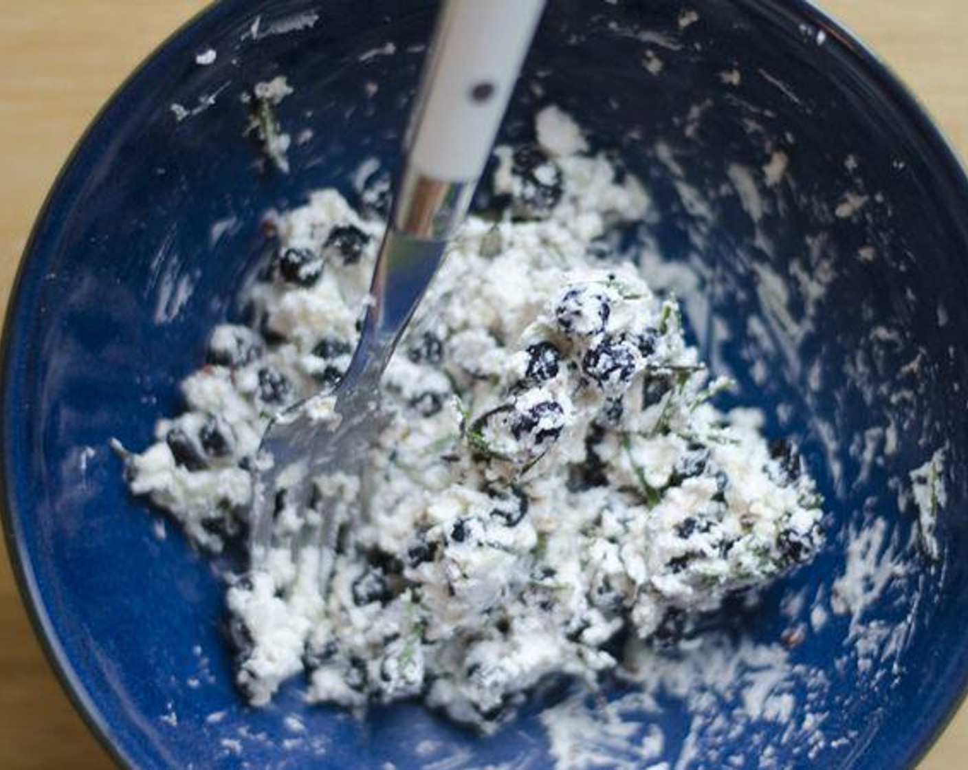 step 2 Mix together Goat Cheese (1/2 cup), Dried Blueberries (1/2 cup), Fresh Rosemary (1 Tbsp), Garlic (2 cloves), and Crushed Red Pepper Flakes (1/2 tsp).