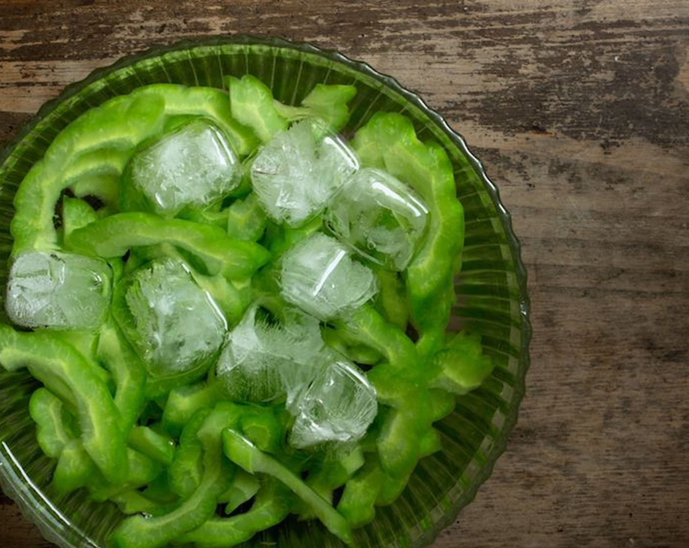 step 11 Drain and run the bitter melon under cold water in a strainer or throw it in a ice bath to stop the cooking process.