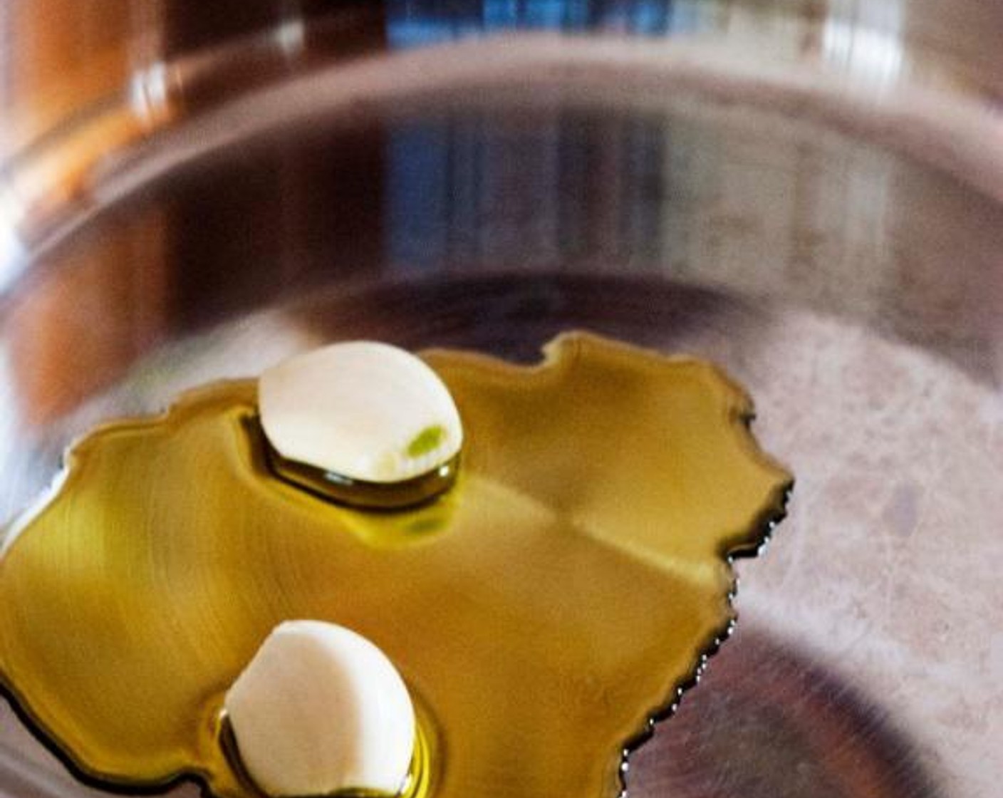 step 2 In an ovenproof skillet, heat up the Extra-Virgin Olive Oil (2 Tbsp) and Garlic (2 cloves) until the cloves turn golden-brown in color. Use low-medium heat, you want to slowly infuse the oil with garlic flavor.