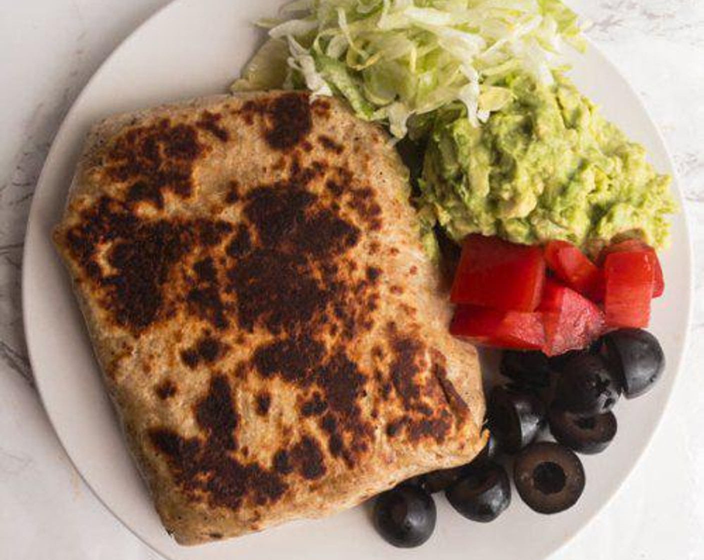 step 3 Spray a pan and put folded-side of tortilla face down and cook 1-2 minutes until brown, flip and cook the other side.