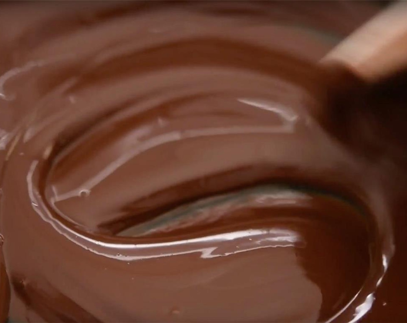 step 8 Place the Dark Chocolate (to taste) in a heatproof bowl and set it over a saucepan of simmering water. Do not allow the simmering water to touch the bowl, only the steam. Stir chocolate occasionally with a wooden spoon until smooth and dissolved.