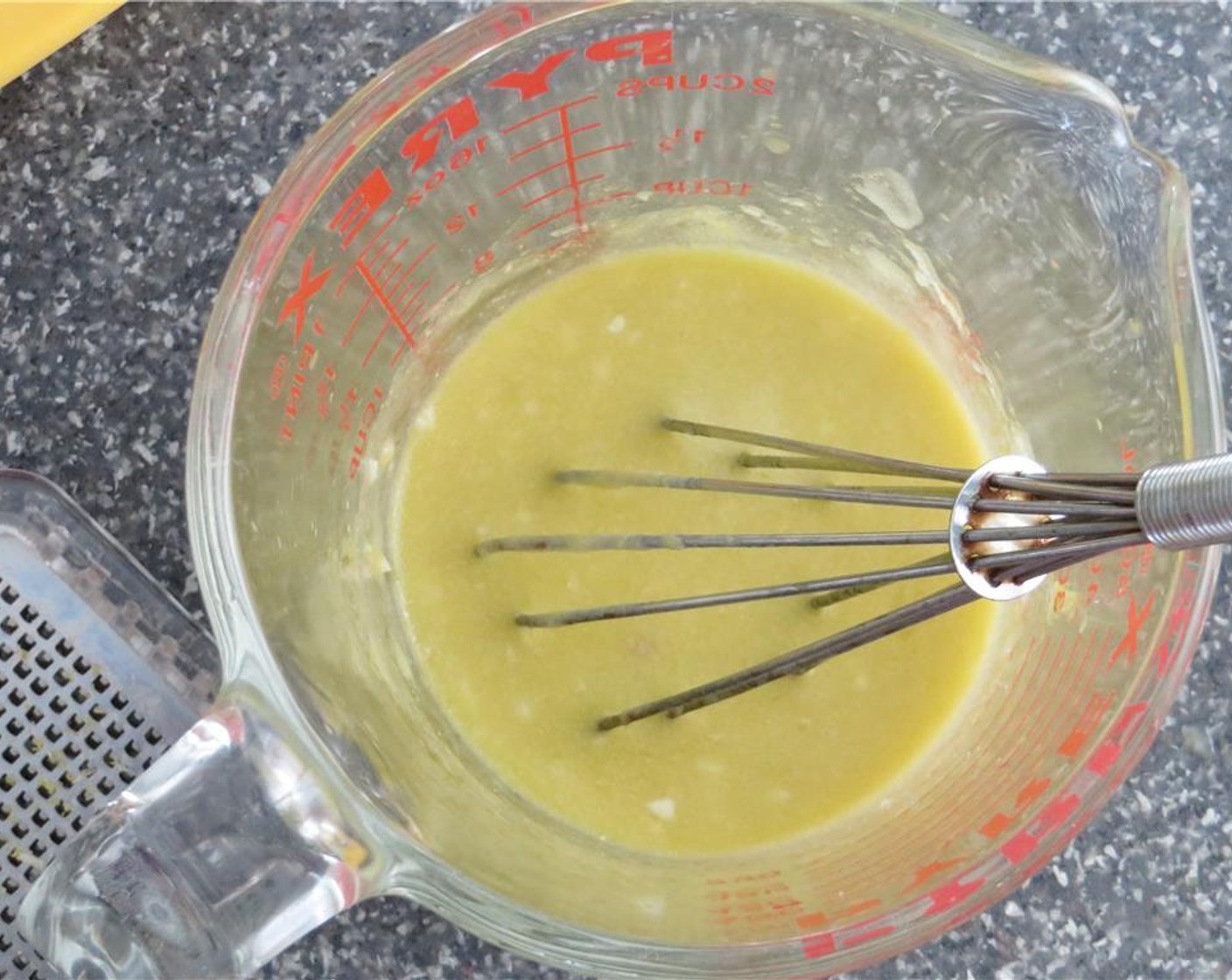 step 7 In a glass measuring cup, add garlic, zest and juice from Lemons (1 1/4), Olive Oil (1/2 cup), and Dijon Mustard (1 Tbsp). Whisk to combine. Pour dressing over the salad. Add fresh mint and fresh basil. Toss to combine. Serve, and enjoy!
