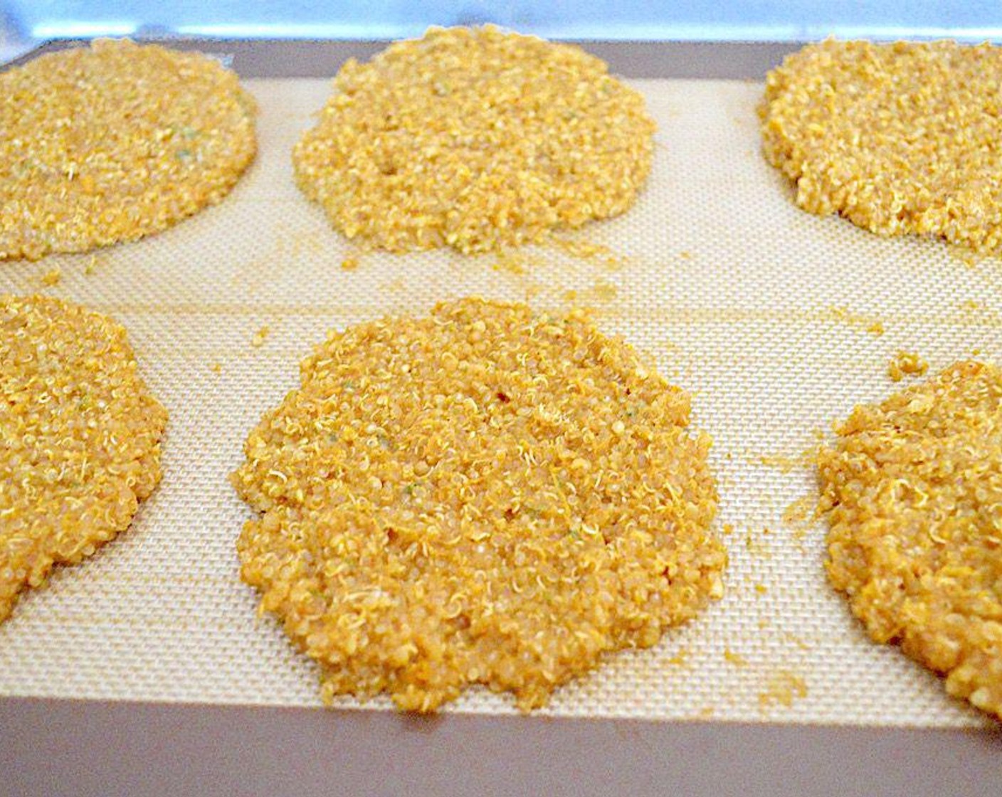 step 6 Use wet hands to form 10-12 patties out of the mixture, depending on how big you want them. Evenly lay them out on the sheet trays and bake them for 30 minutes or until set and slightly crisp along the edges.