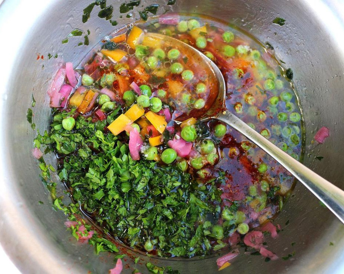 step 2 Make the dressing by combining the Vinaigrette (to taste), Green Peas (to taste), Fresh Cilantro (to taste), Red Onions (to taste), and Yellow Bell Peppers (to taste) to a bowl. Add the Octopus (to taste) and mix well.