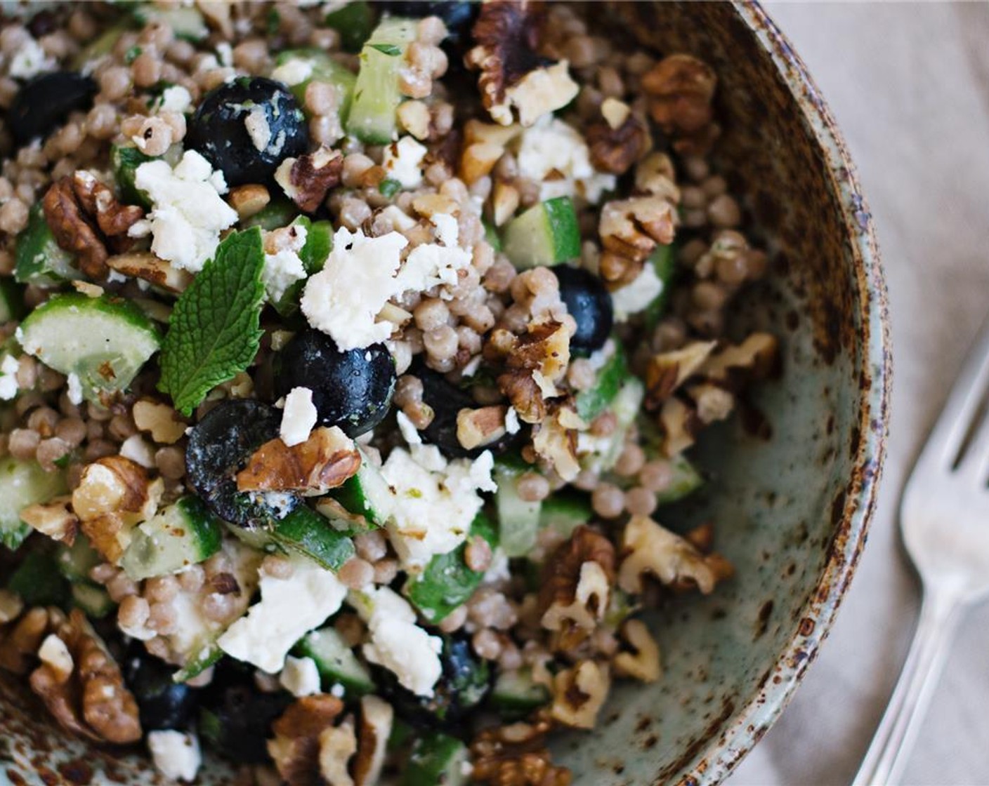 step 7 Serve couscous salad at room temperature and garnish with walnuts. Serve and enjoy!