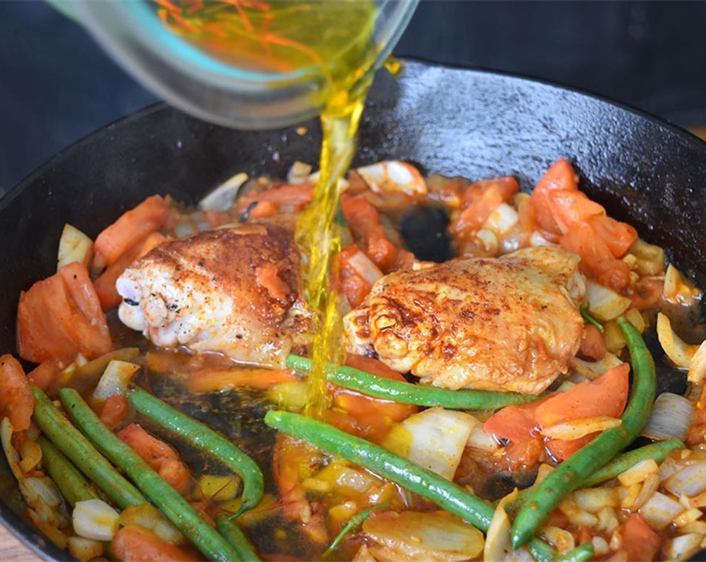 step 4 Once garlic is soft, add saffron with the steeped water and Chicken Broth (7 cups). Bring to a boil.