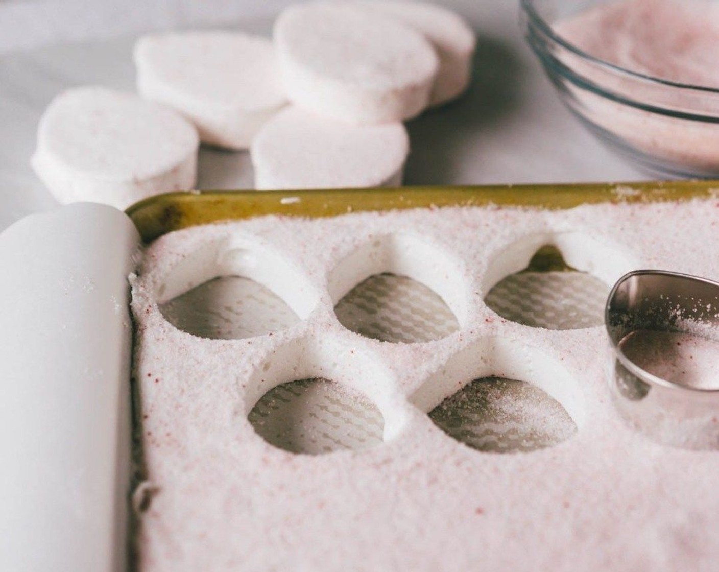 step 8 Sprinkle about half of the sugar onto the top of the set marshmallows and spread around the entire surface. With your desired cookie cutter, cut out your shapes then dip into the additional sugar and set aside.