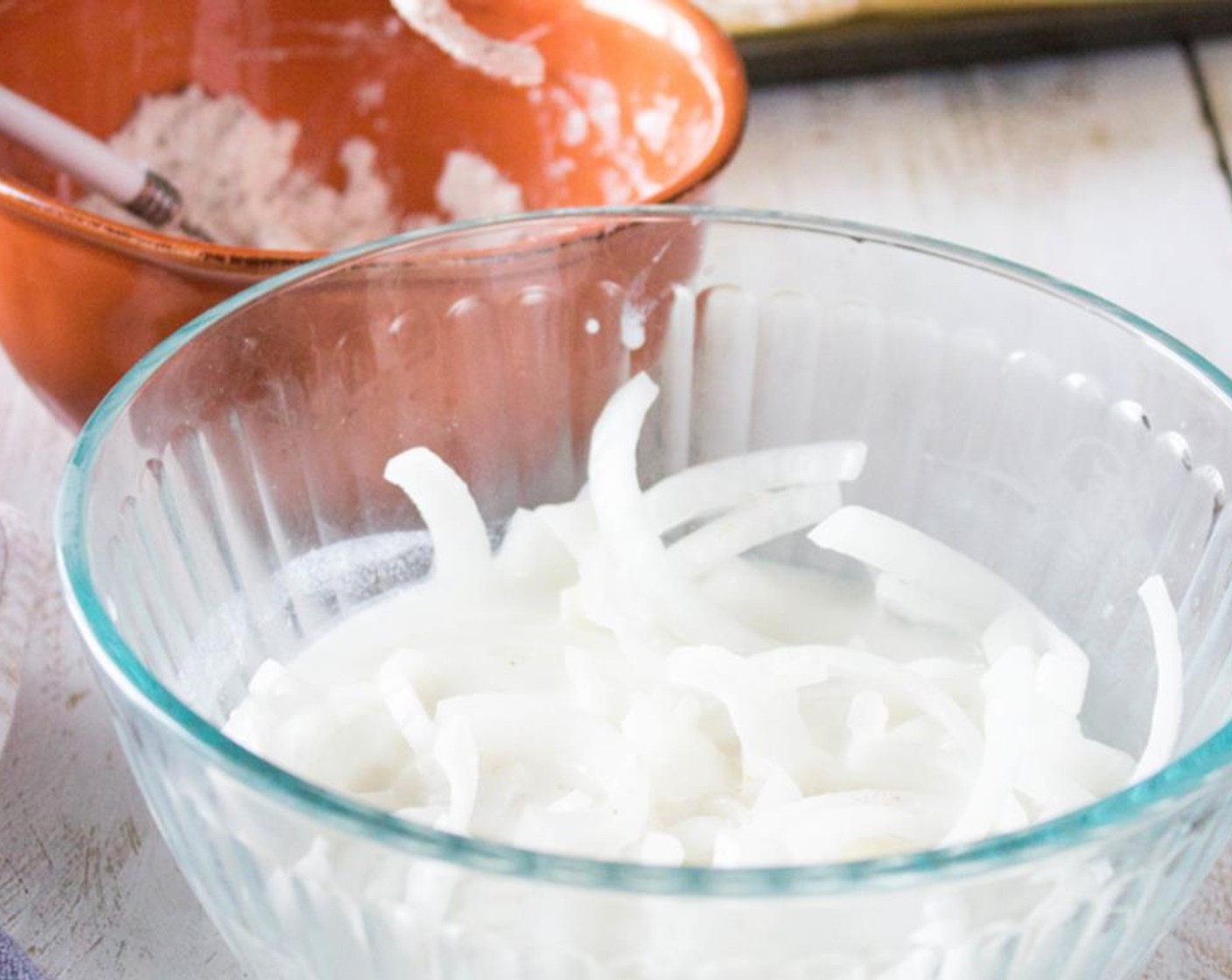 step 4 Remove onions from milk, dip into dry mixture and cover completely.