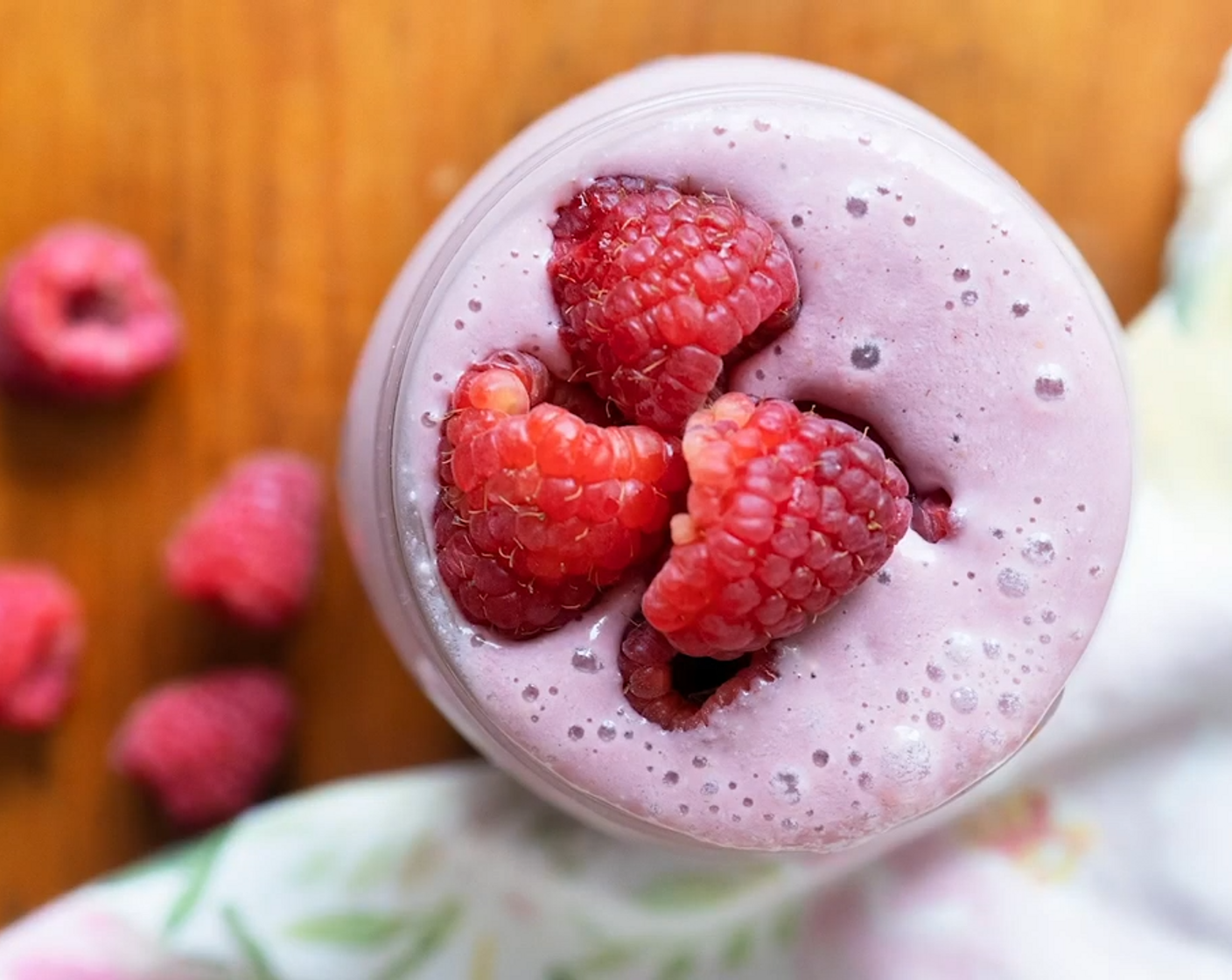 step 1 Place Fresh Raspberry (3/4 cup), Plain Yogurt (1/2 cup), Raw Cashews (1/4 cup), Plant-Based Vanilla Protein Powder (1 scoop), Medjool Dates (1), and Non-Dairy Milk (to taste) into a high power blender and blitz until smooth and creamy.