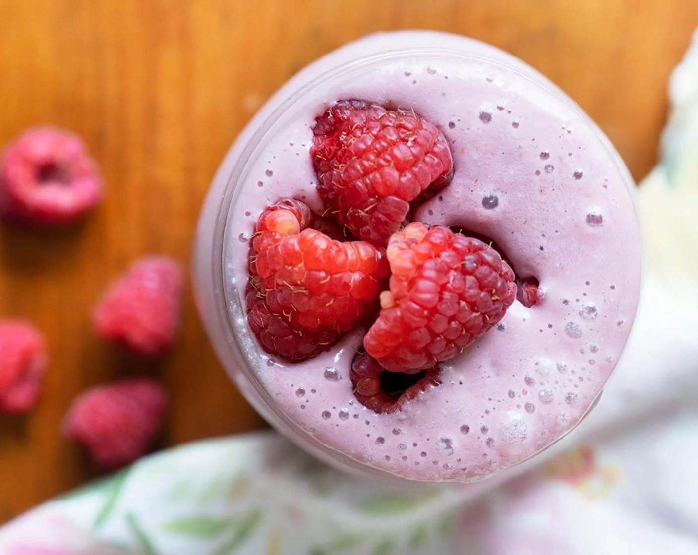 step 1 Place Fresh Raspberry (3/4 cup), Plain Yogurt (1/2 cup), Raw Cashews (4 Tbsp), Plant-Based Vanilla Protein Powder (1 scoop), Medjool Dates (1), and Non-Dairy Milk (to taste) into a high power blender and blitz until smooth and creamy.