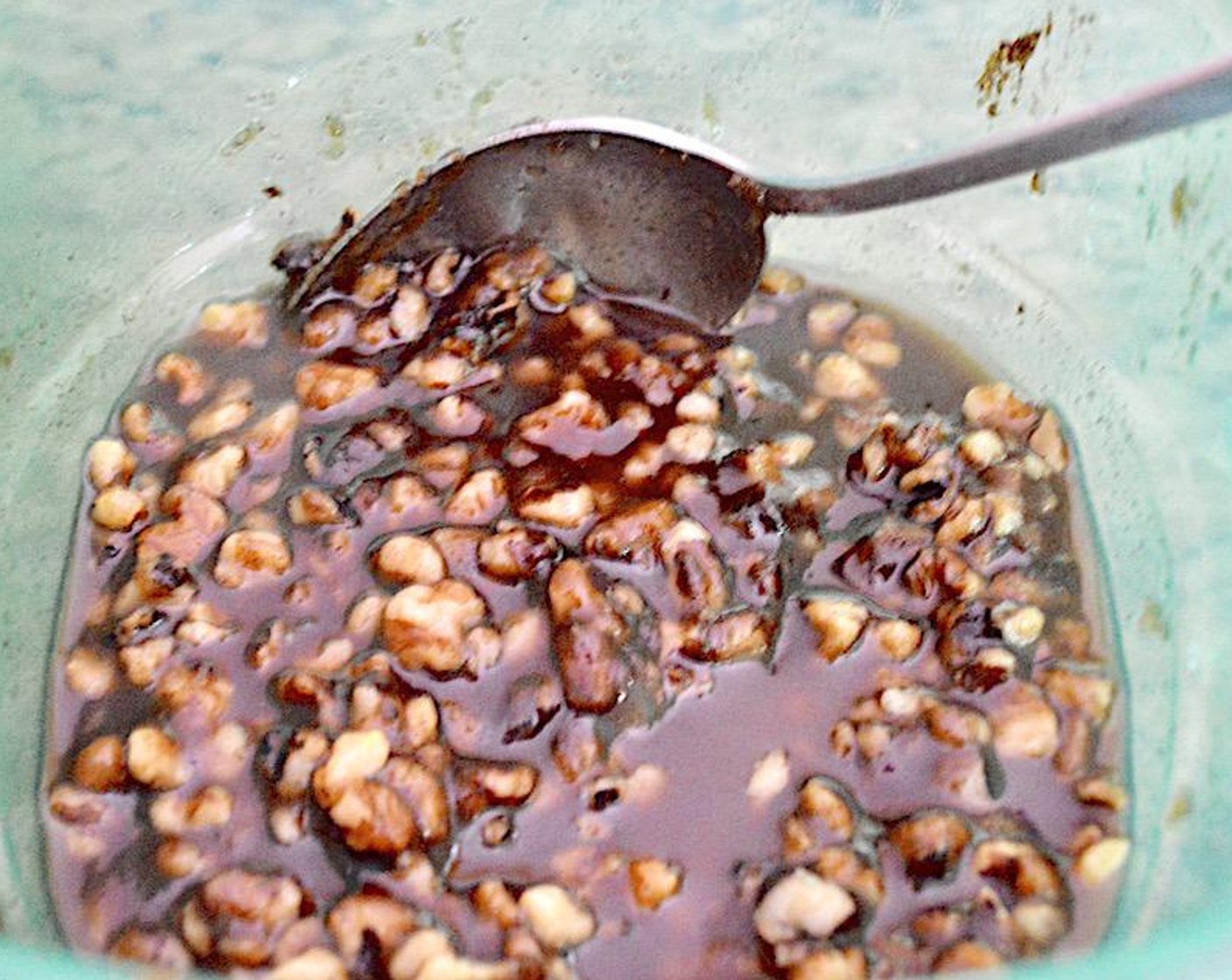 step 4 Turn out the sweet potato mixture into the pan and spread it out evenly, smoothing out the top. Then make the easy topping. Stir the Walnut (1 cup), Dark Brown Sugar (2/3 cup), Ground Cinnamon (1/2 tsp), Salt (1 pinch), Butter (1/3 cup), and Vanilla Extract (1/2 tsp) together thoroughly in a bowl until it is a sticky glaze. Evenly pour it over the sweet potato mixture, using a spoon to spread it out thinly.