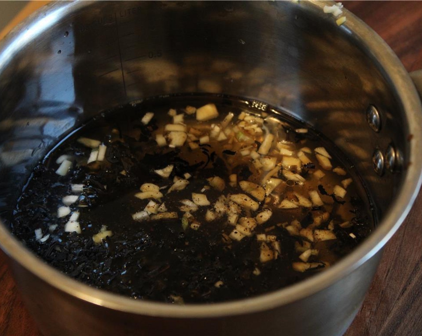 step 2 In a large pot, add the Bird Pick Organic Lapsang Souchong Tea Leaves (2 Tbsp), Garlic, Onions (to taste), Water (1/2 cup), Hoisin Sauce (3 Tbsp), Rice Vinegar (1 Tbsp), Sesame Oil (1 Tbsp), Bird Pick® Kamahi Honey (1 Tbsp), Salt (to taste) and Ground Black Pepper (to taste), and bring to a boil.