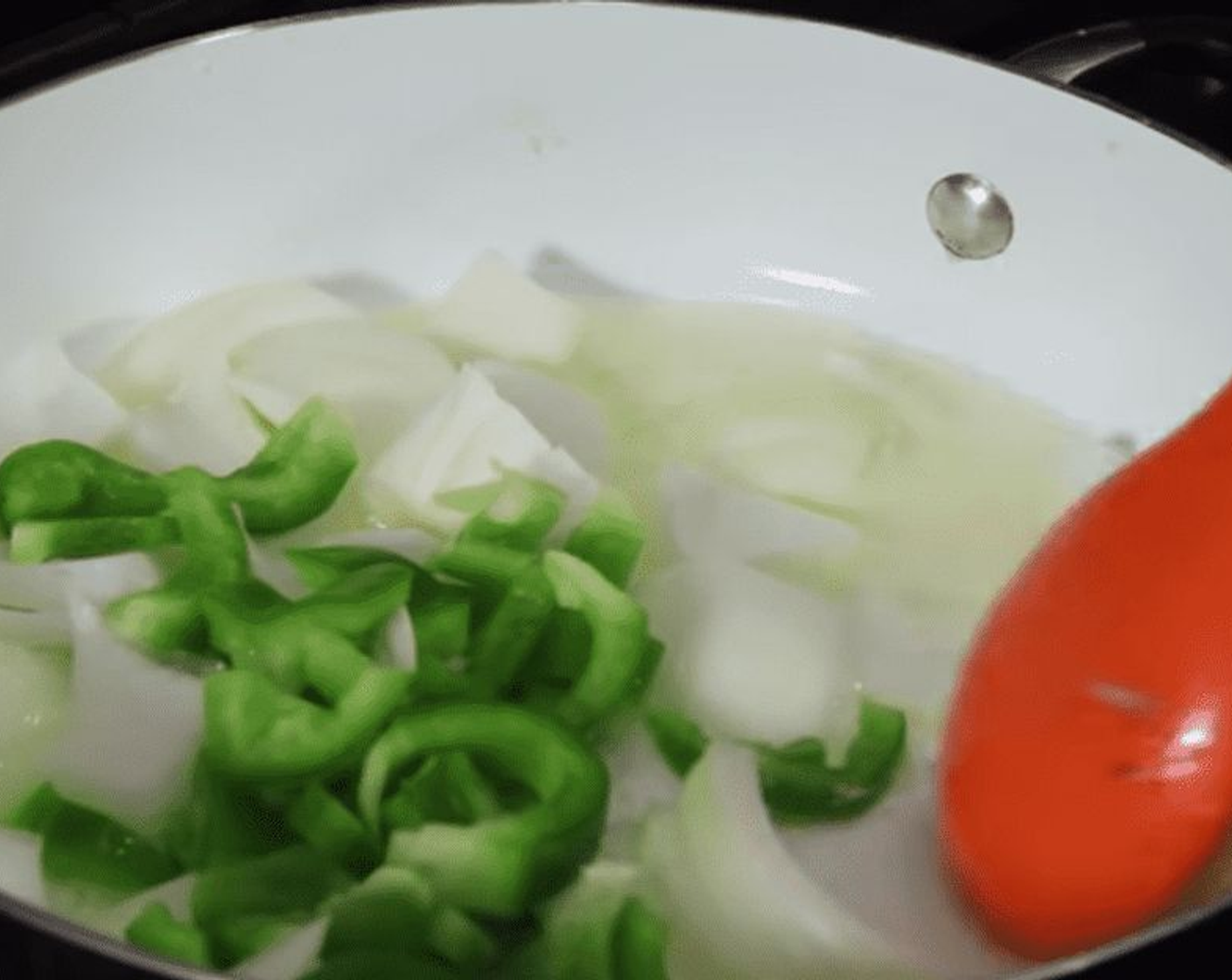 step 3 Saute Onion (1/2 cup) and Green Bell Pepper (1/2 cup) in a large pan with Butter (2 Tbsp).