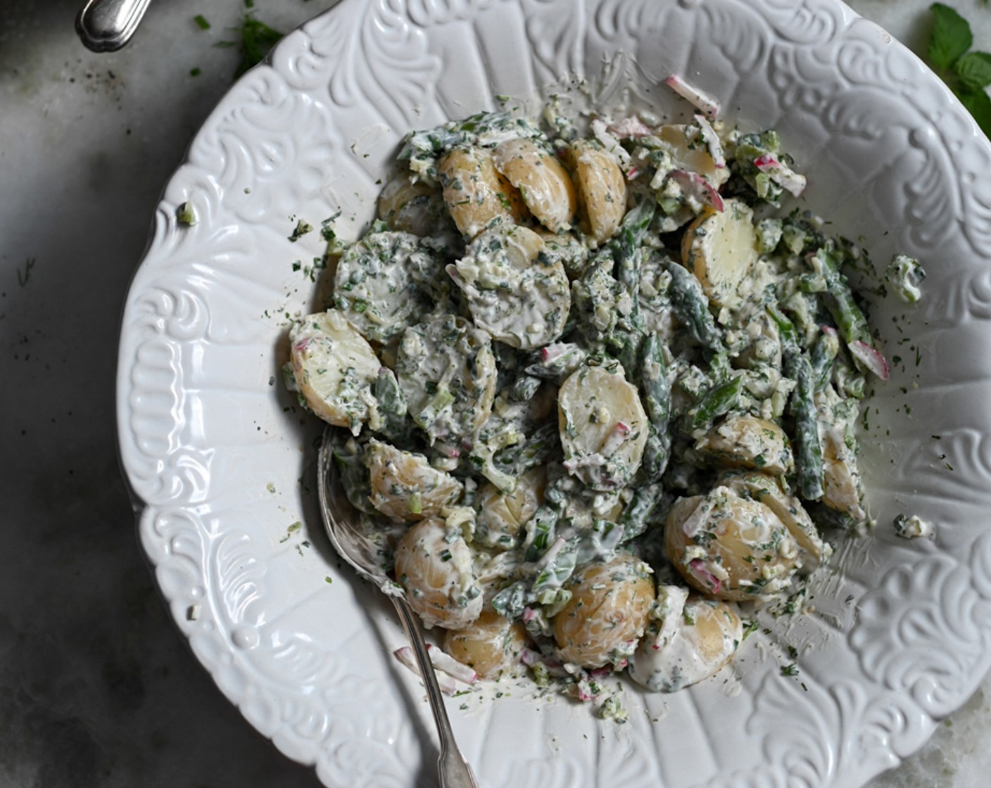 step 10 Add the flaked trout to the bowl with the potatoes and pour the dressing. Gently combine the salad and divide it across 6-8 plates.