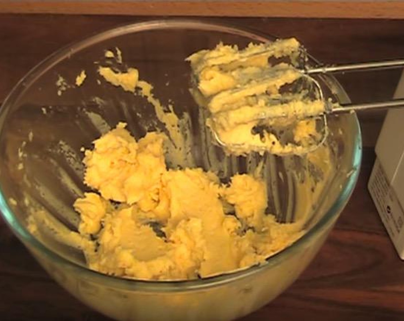 step 2 In a mixing bowl, add Butter (6 oz), Caster Sugar (1/2 cup) and Vanilla Extract (1 tsp). Using an electric mixer, beat together until fluffy.