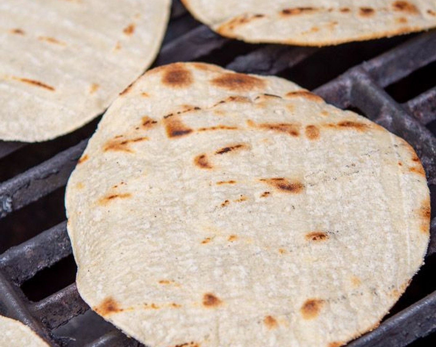 step 7 For grilled tortillas, clean grate then place Flour Tortillas (12) directly on dry grill. Grill for 2 minutes per side, or until char marks start to appear. Store warm tortillas in foil until ready to serve.
