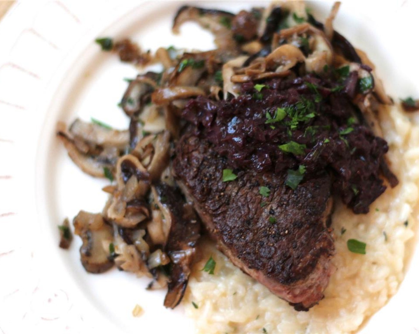 step 7 Serve the filets with the sauce spooned on top alongside herb risotto and mushroom ragout!