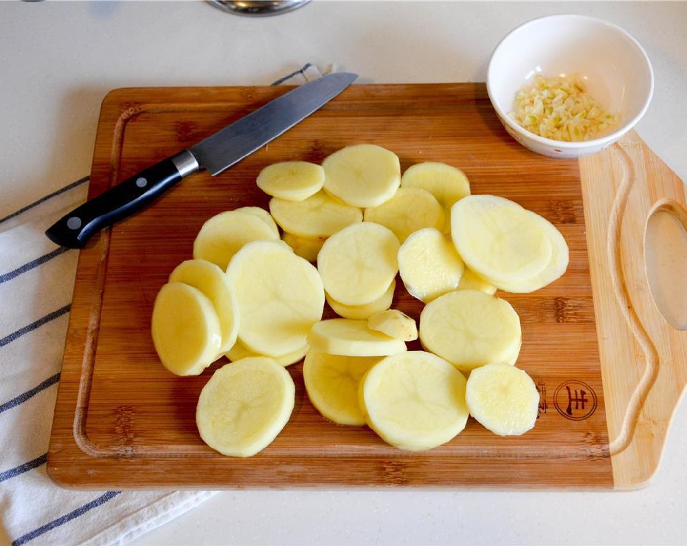 step 3 Peel and slice the Potatoes (2.2 lb) 1/2 inch thickness. Try to slice them to relatively the same size, so they can cook uniformely in the oven.