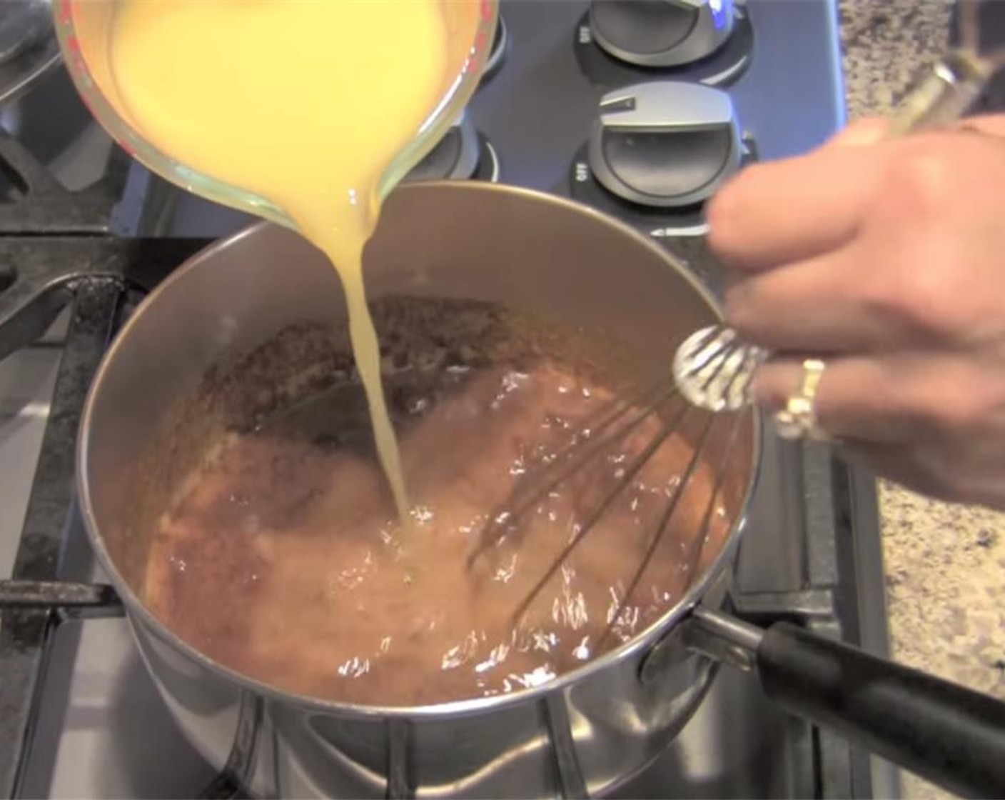 step 2 Add Chili Powder (4 Tbsp) and whisk until fully mixed. Slowly pour in Low-Sodium Chicken Broth (2 cups), turn heat to medium, and stir until fully combined.