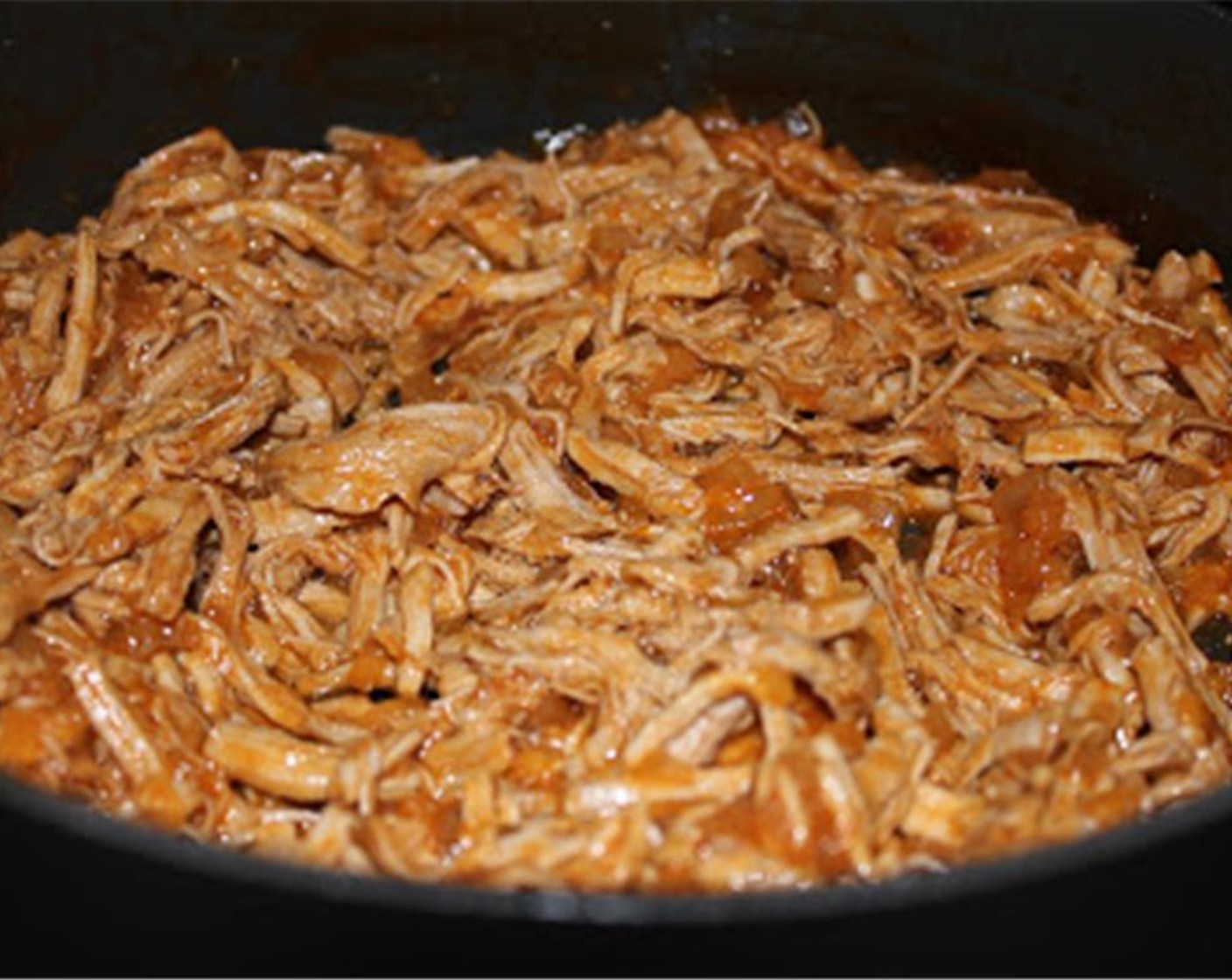 step 8 Add the shredded pork back to the sauce and cook for another 10 minutes over low heat.