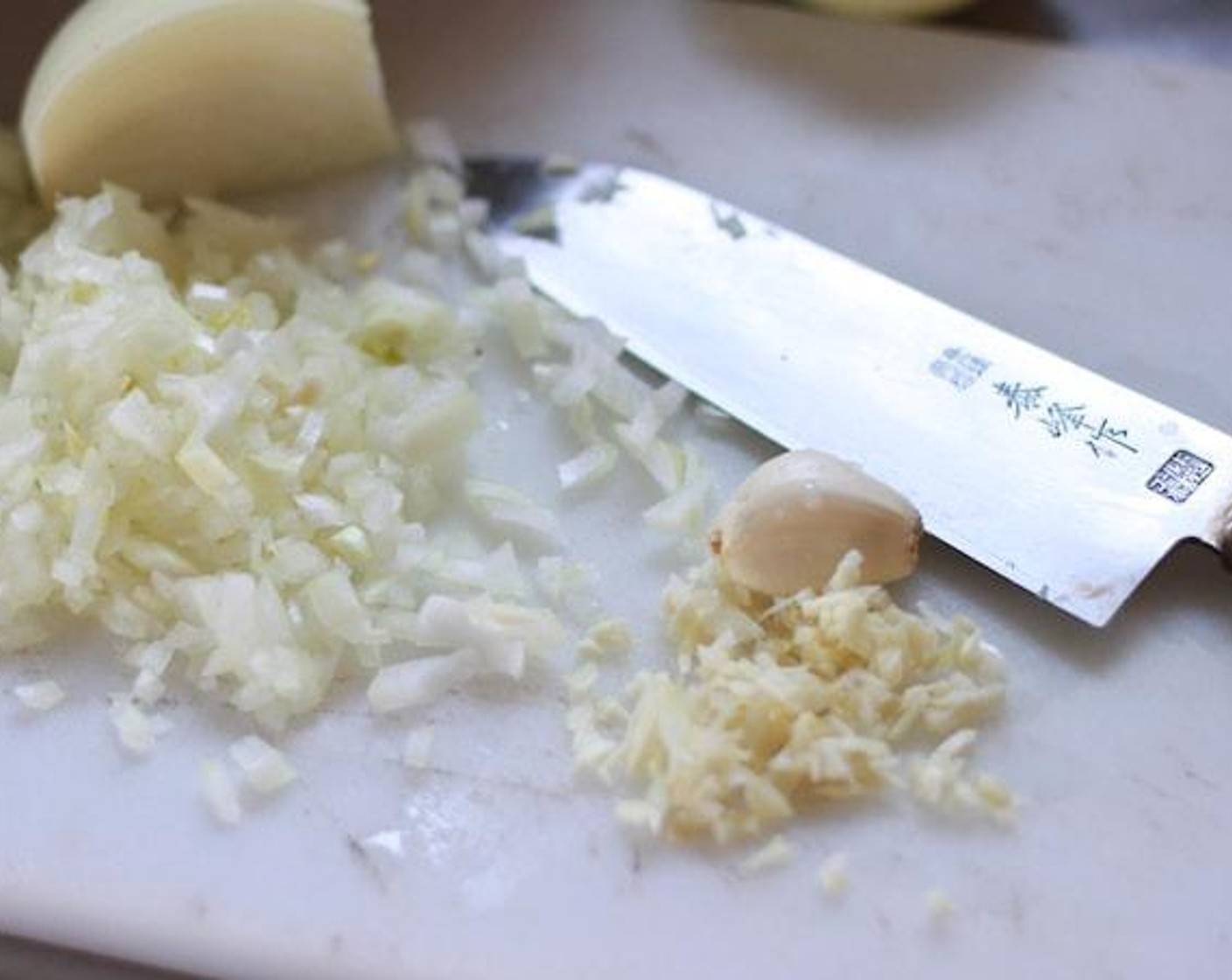 step 5 Chop the Garlic (2 cloves) and Onion (1/3 cup) into small pieces.