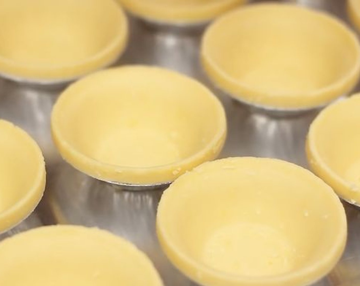 step 7 Mold the dough into 24 mini tartlets.