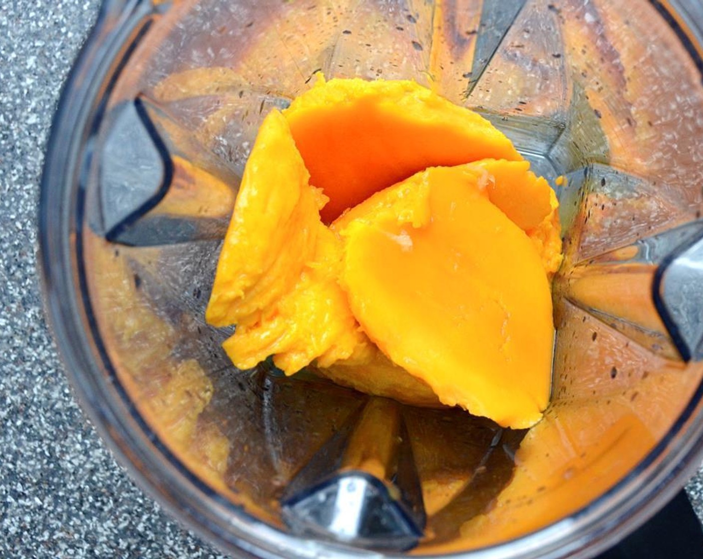 step 2 Transfer the mango to a heavy-duty blender or food processor and add the juice from Lime (1), Light Corn Syrup (1/4 cup), and Salt (1/4 tsp).