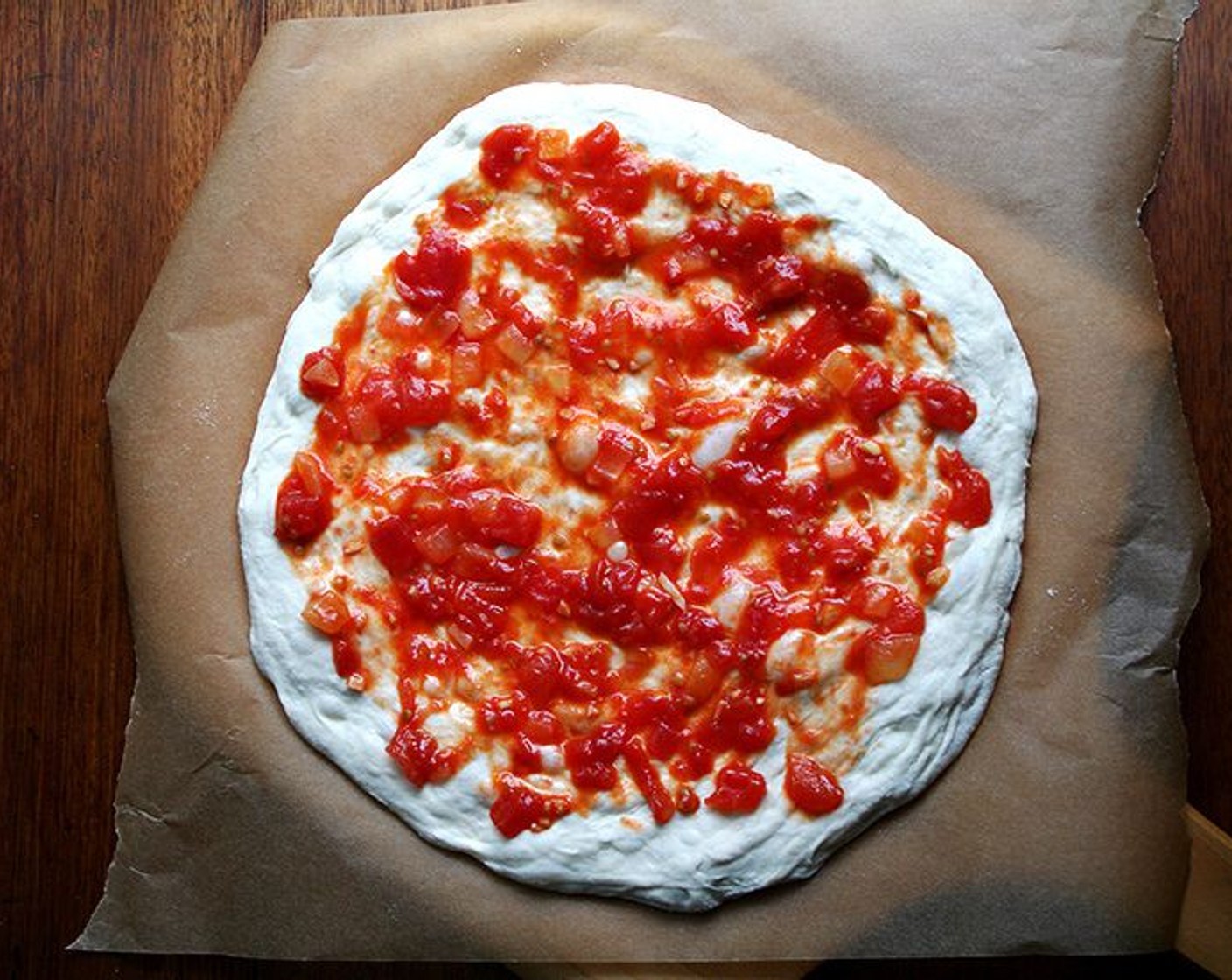 step 9 Spoon Tomato Sauce (2 cups) in a light layer over the dough's surface.