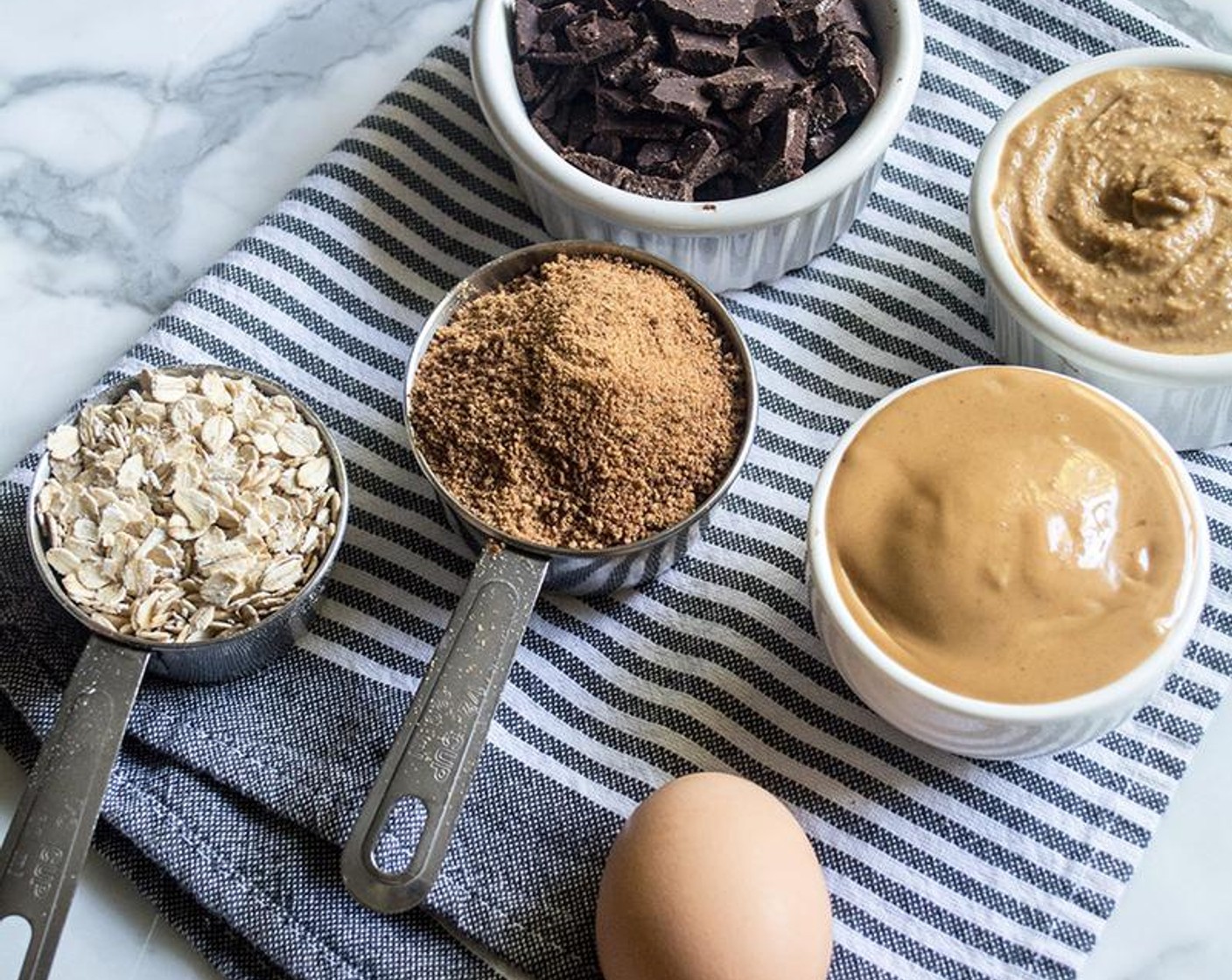 step 3 Add Peanut Butter (1/2 cup), Powdered Peanut Butter (1/2 cup), Water (1/3 cup), Coconut Sugar (2/3 cup), Baking Soda (1/2 tsp), and Sea Salt (1/8 tsp) to large bowl, and mix until well combined. Stir in Egg (1) and Vanilla Extract (1/2 Tbsp), then mix until just combined.