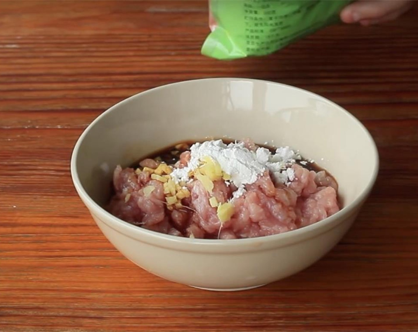 step 5 Mix the Pork (1 cup) with Fresh Ginger (1 tsp), Light Soy Sauce (1 Tbsp), and Corn Starch (1/2 Tbsp).