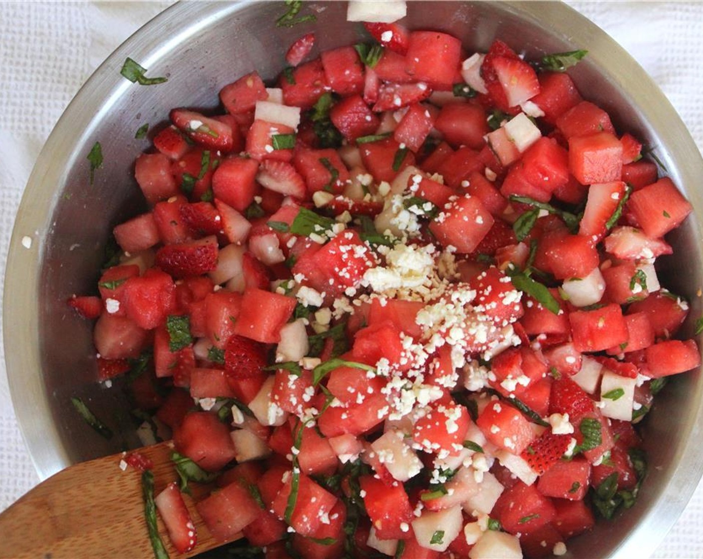 step 3 Toss the cut watermelon, jicama, and strawberries with the chopped mint, basil, and juice from Lemon (1).