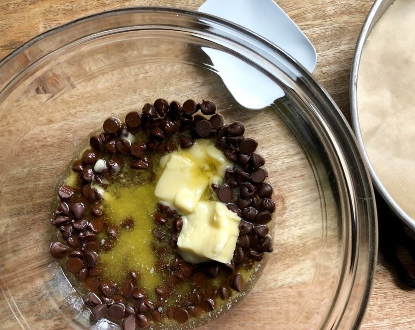 step 3 Place Semi-Sweet Chocolate Chips (1 cup) and Salted Butter (1/2 cup) in a medium to large sized microwave-safe mixing bowl. Microwave for 30 seconds at a time, stirring in between until everything is melted and smooth.